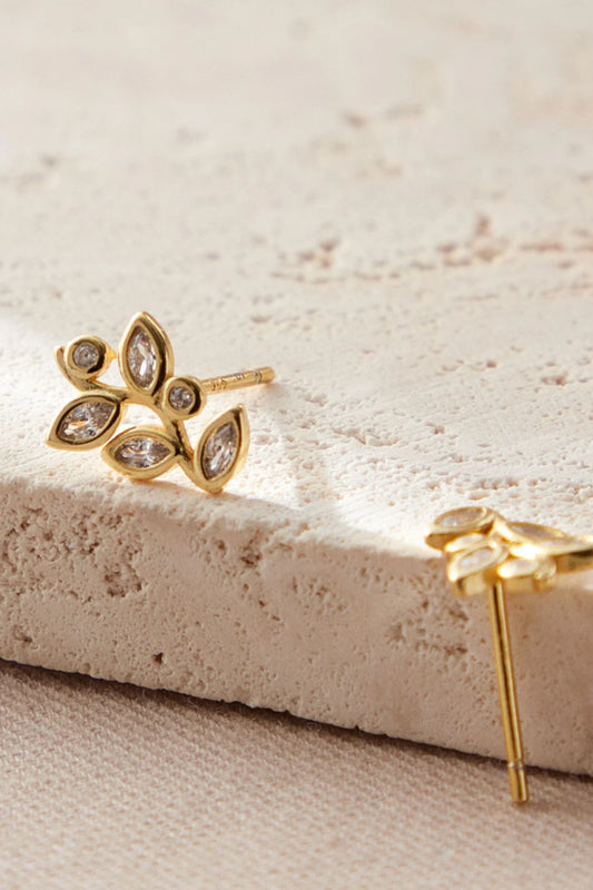 sterling-silver-crystal-leaf-studs-in-gold-closeup