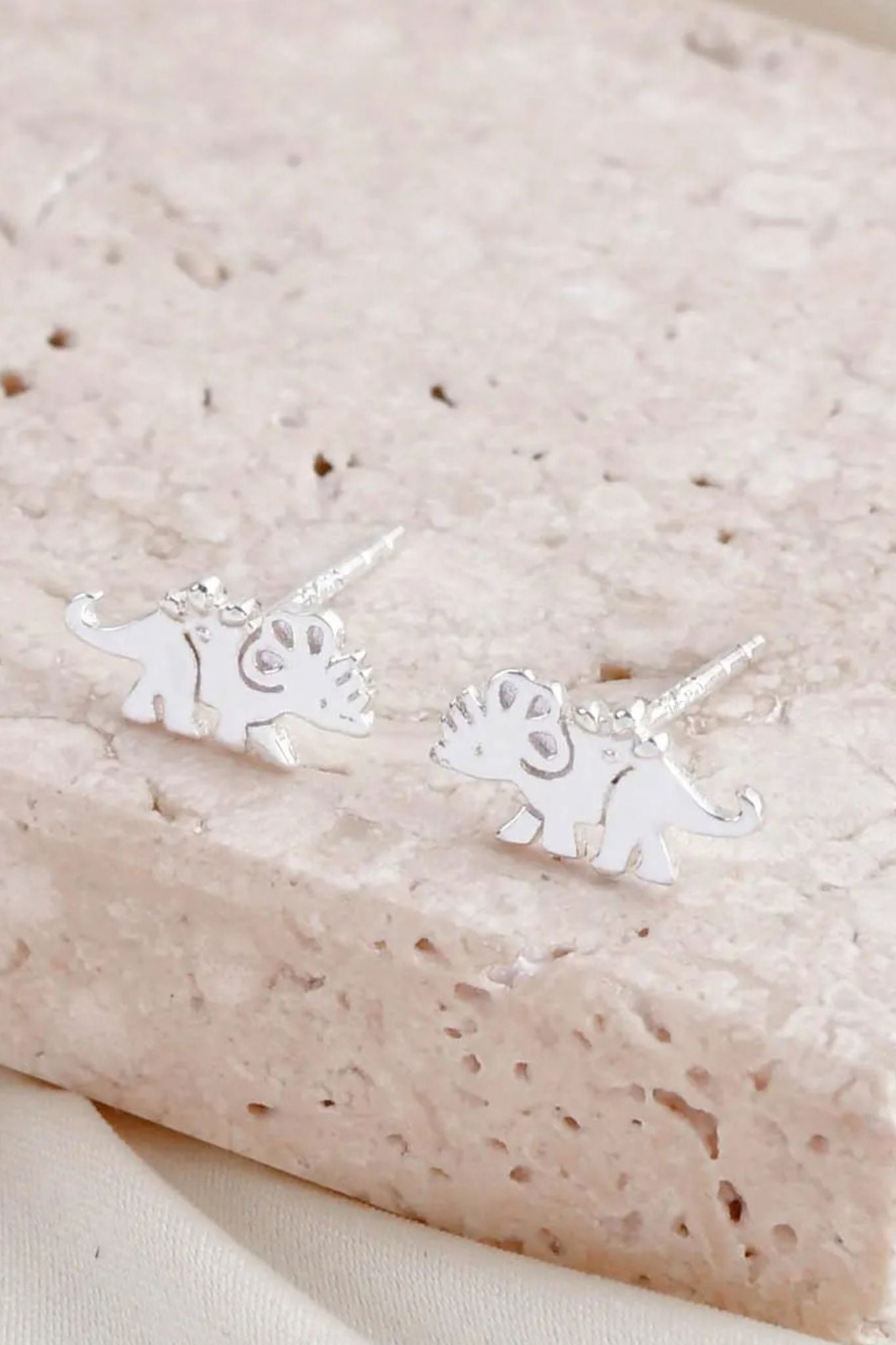 sterling-silver-triceratops-dinosaur-studs-closeup