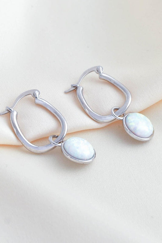 sterling-silver-opal-hoops-lying-flat