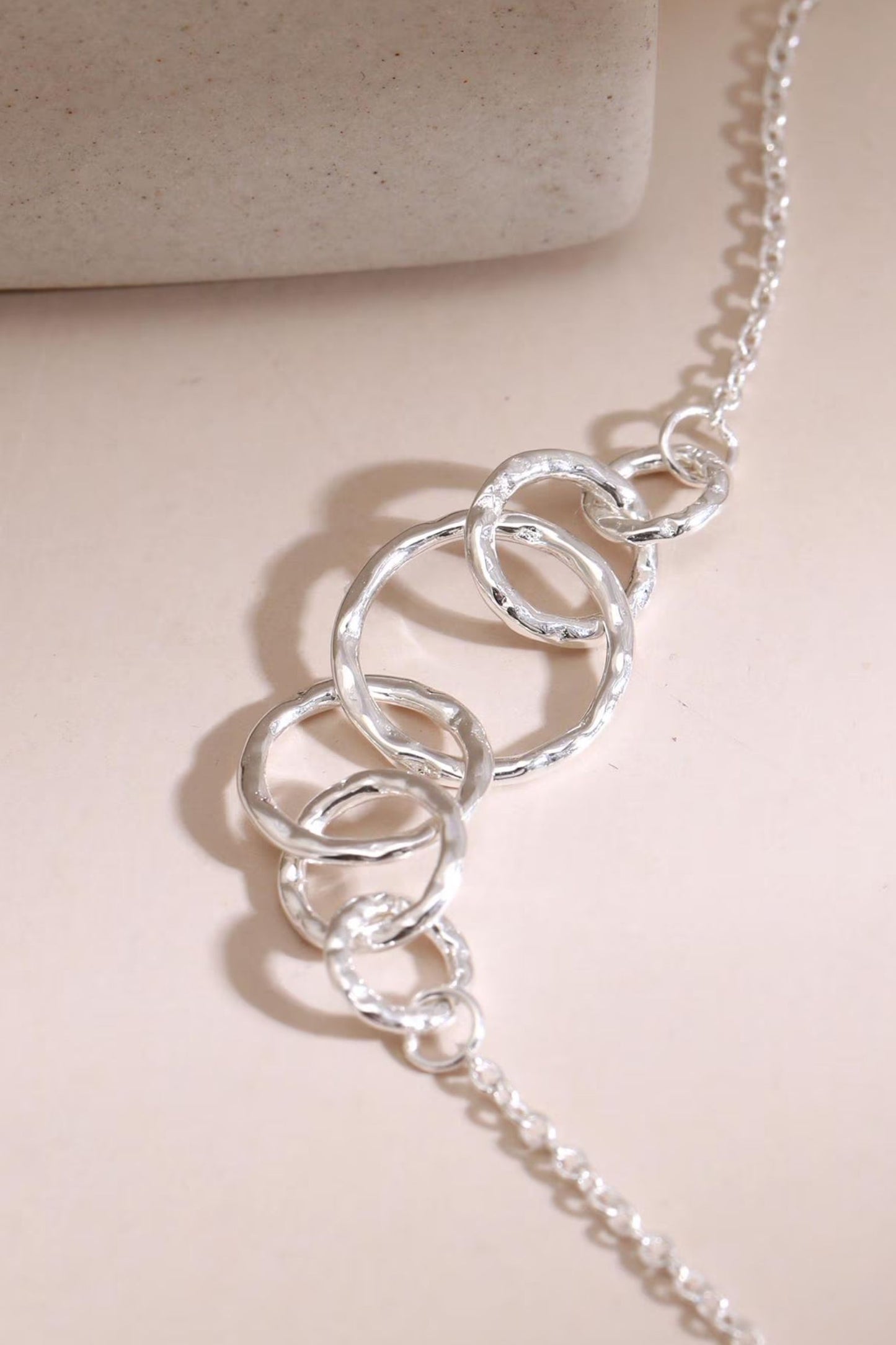 sterling-silver-six-circles-bracelet-closeup-rings