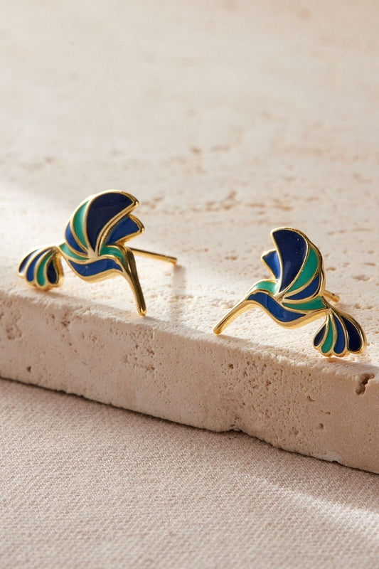 sterling-silver-blue-hummingbird-studs-in-gold-closeup