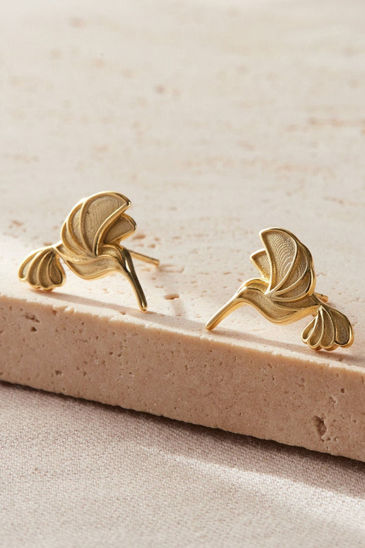 sterling-silver-hummingbird-studs-in-gold-closeup