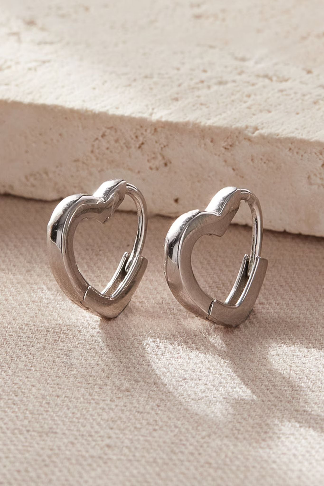 sterling-silver-heart-huggie-hoops-in-silver