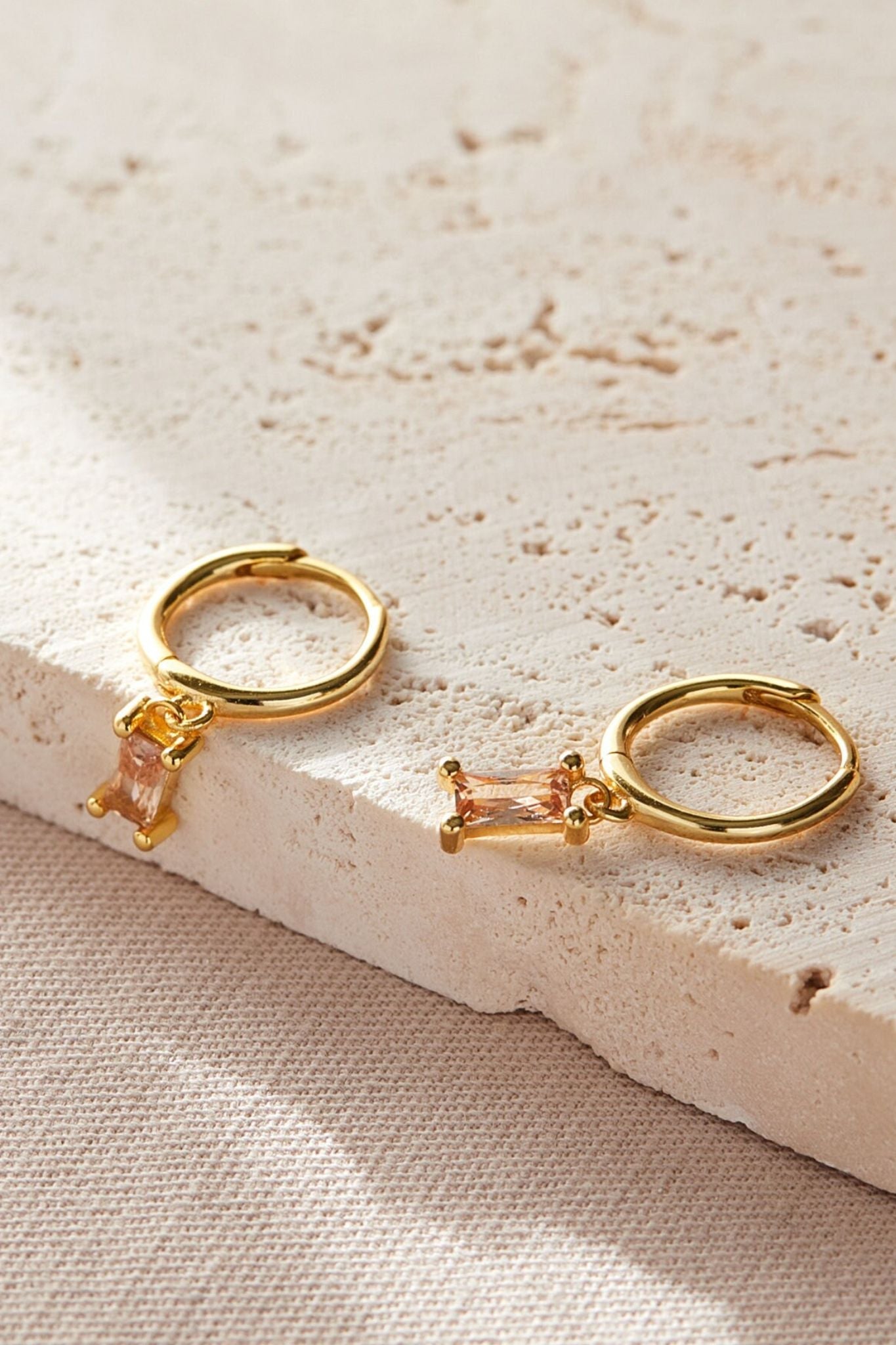 sterling-silver-cz-baguette-hoops-in-gold-peach