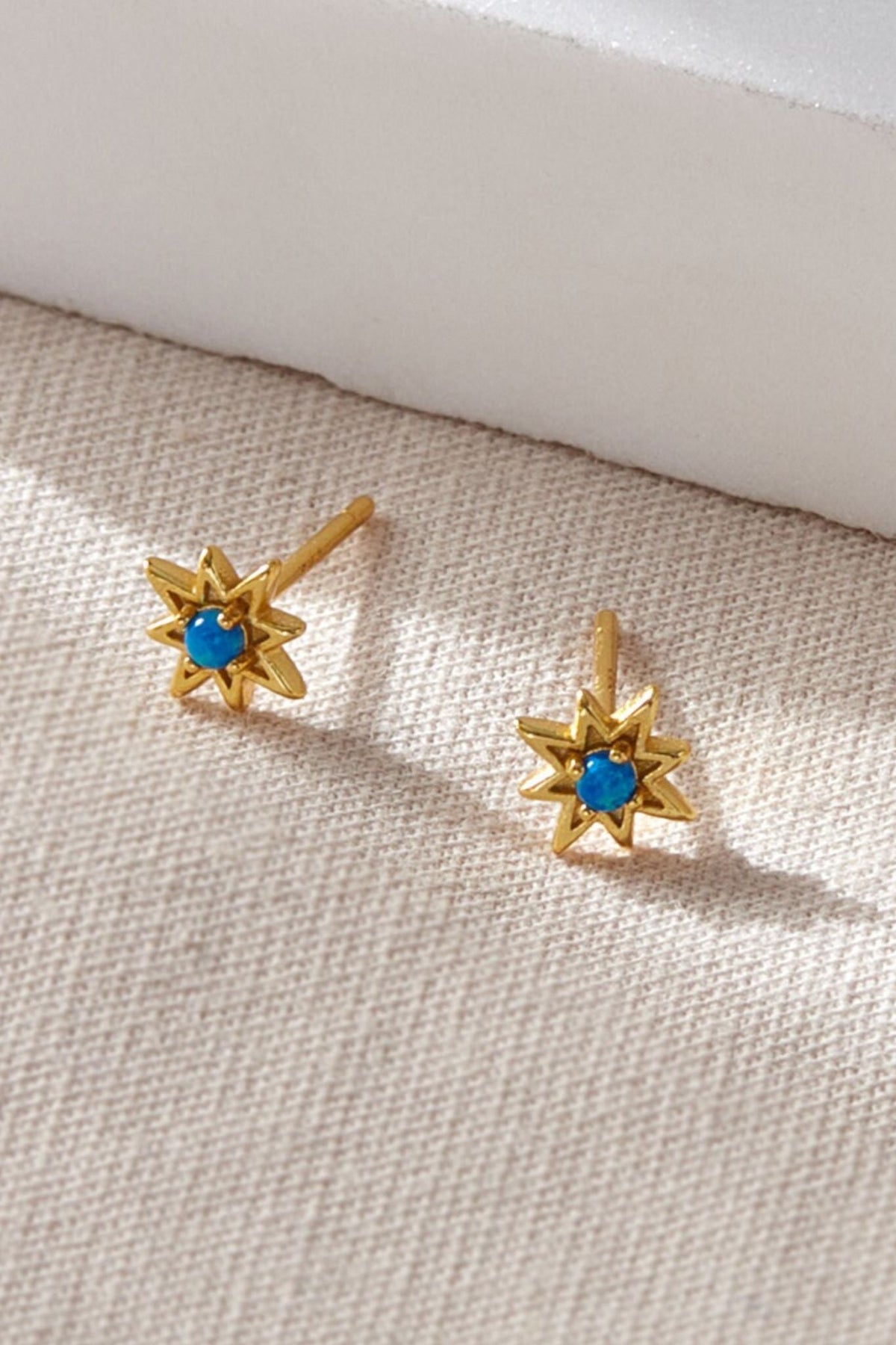sterling-silver-starburst-opal-studs-in-gold
