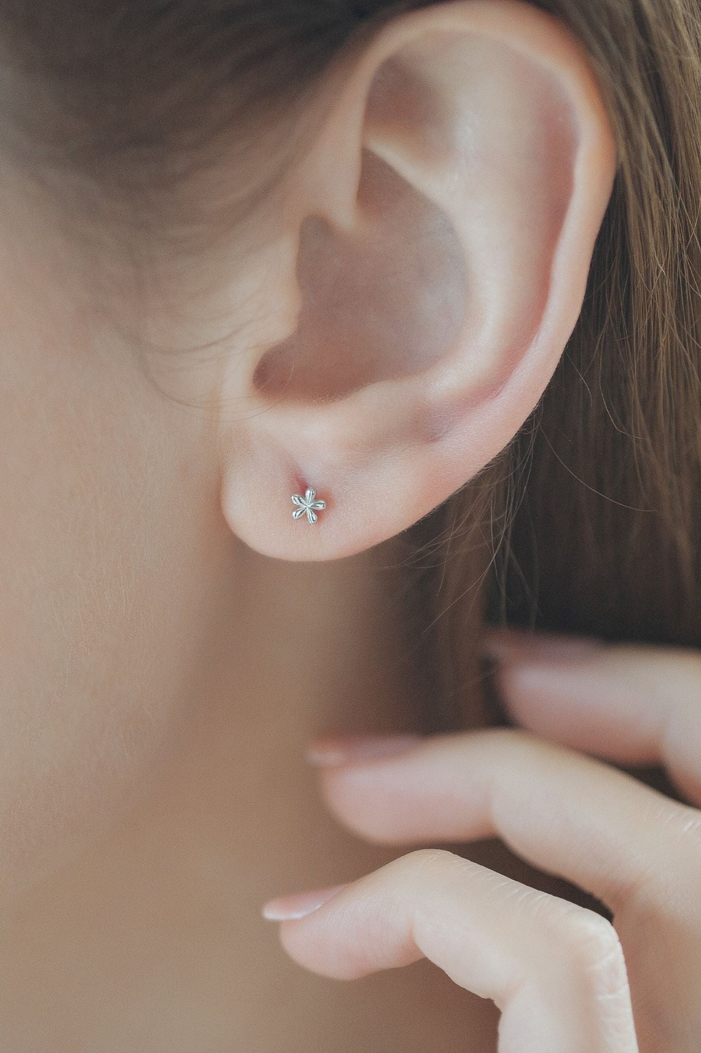 sterling-silver-dainty-floral-studs-4mm-in-silver-model
