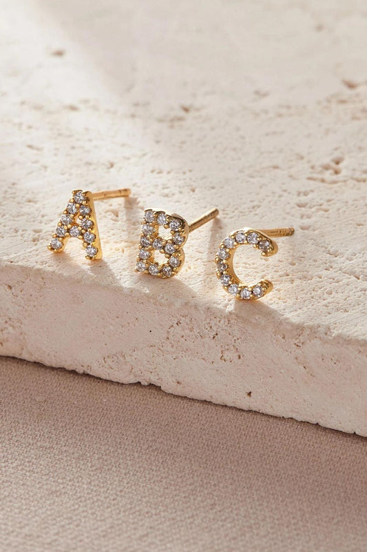 sterling-silver-cz-alphabet-studs-in-gold-single-earrings-closeup