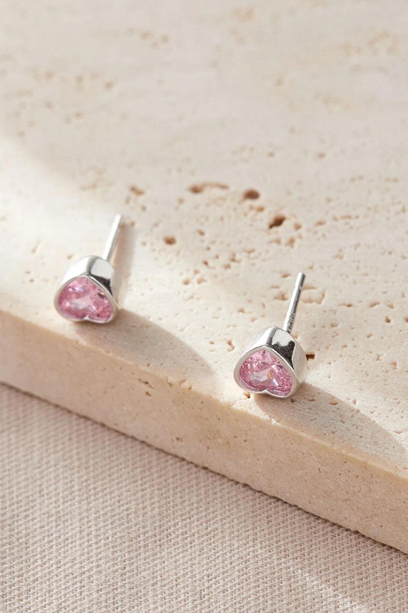 sterling-silver-cz-heart-studs-in-silver-pink-closeup