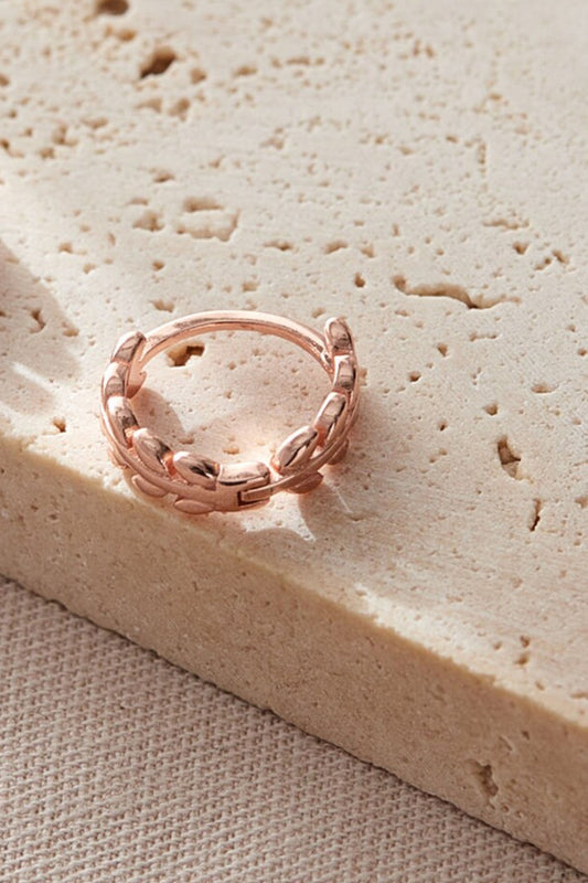 sterling-silver-olive-leaf-huggie-hoops-in-rose-gold-closeup