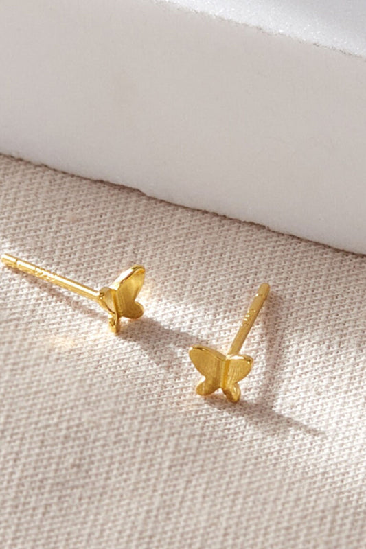 sterling-silver-dainty-butterfly-studs-in-gold-closeup