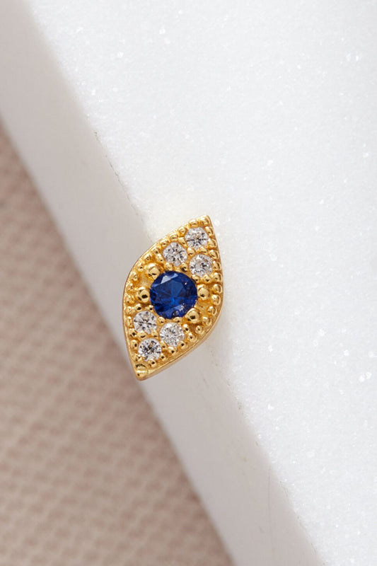 sterling-silver-cz-evil-eye-studs-in-gold-closeup