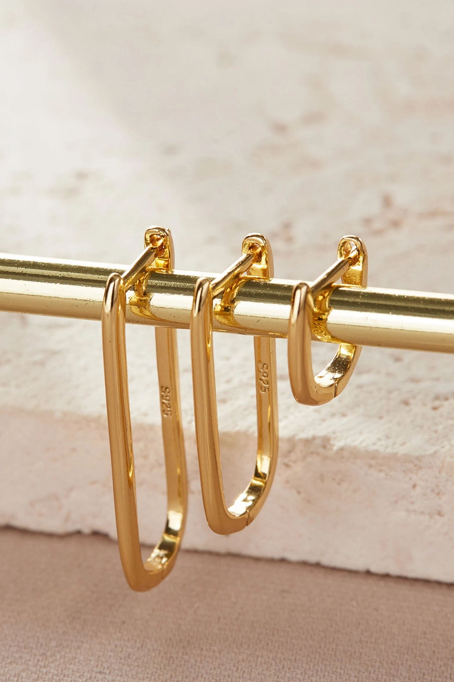sterling-silver-rectangular-hoops-in-gold-closeup