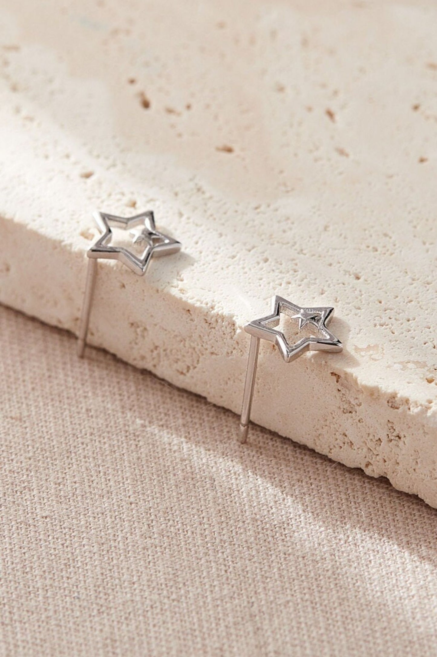 sterling-silver-openwork-dual-star-studs-in-silver-closeup
