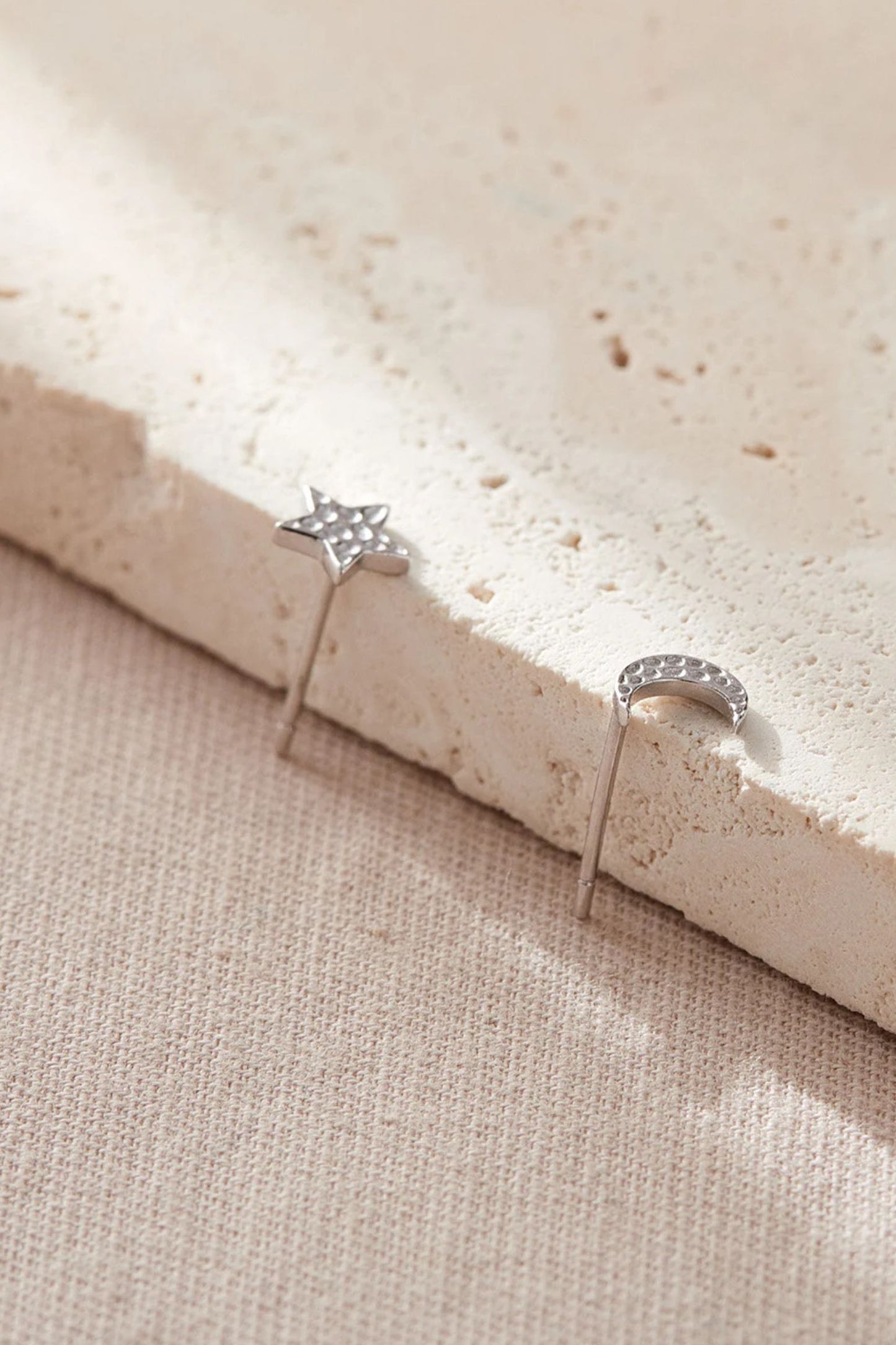 sterling-silver-star-moon-mismatched-hammered-studs-in-silver-pair