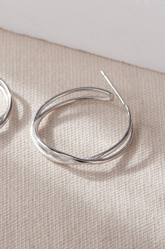 sterling-silver-wave-twist-hoops-23mm-in-silver-closeup