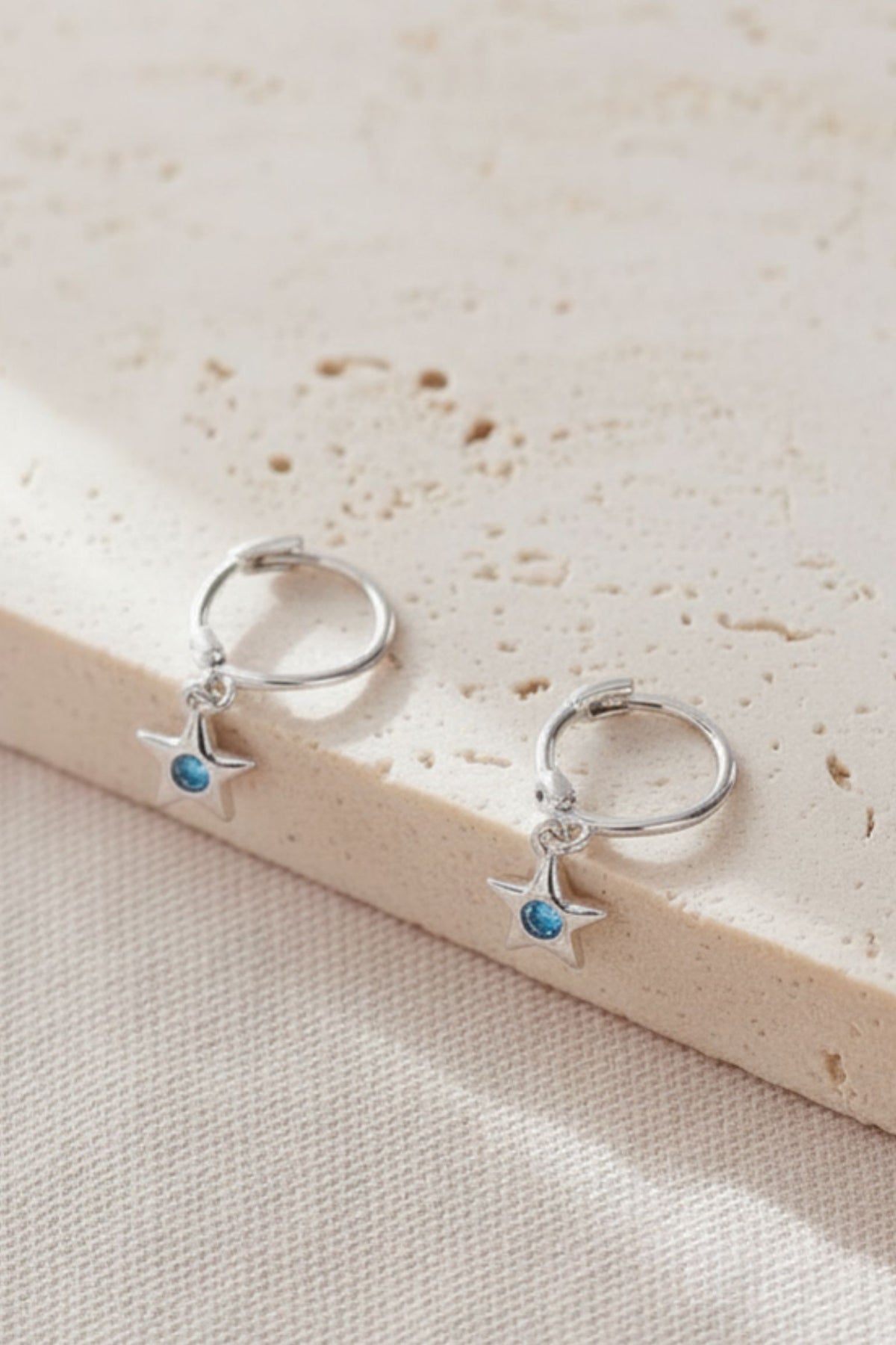 sterling-silver-cz-star-hoops-in-silver-light-blue