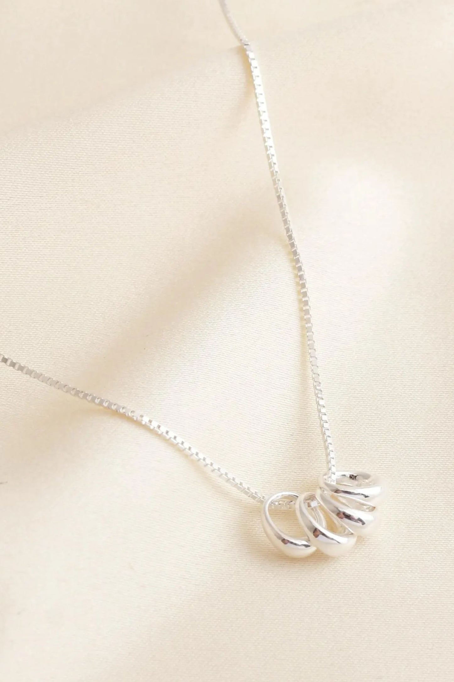 sterling-silver-four-teardrop-hoops-necklace-closeup
