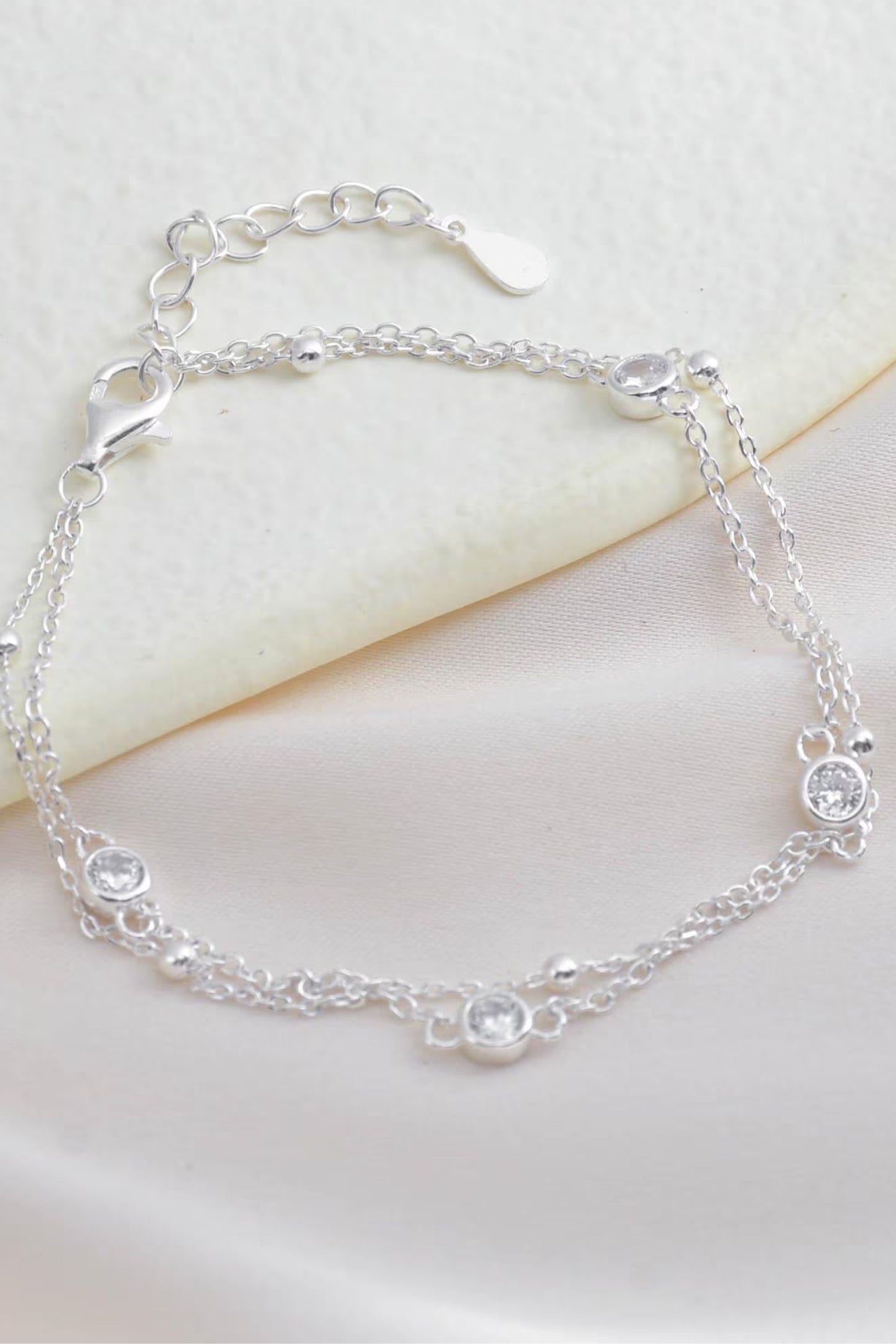 sterling-silver-cz-double-chain-bracelet-lying-flat