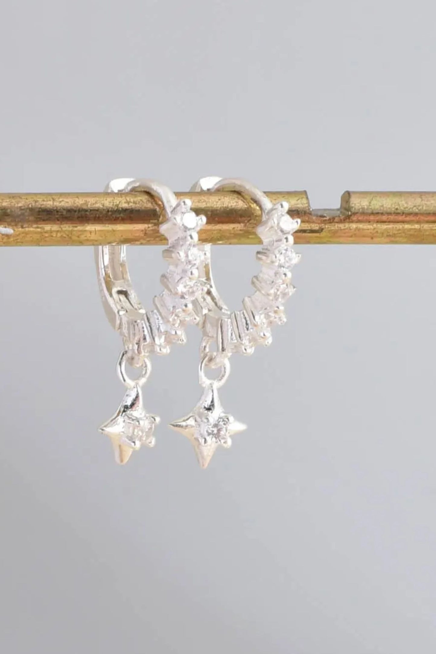 sterling-silver-cz-star-huggie-hoops-closeup