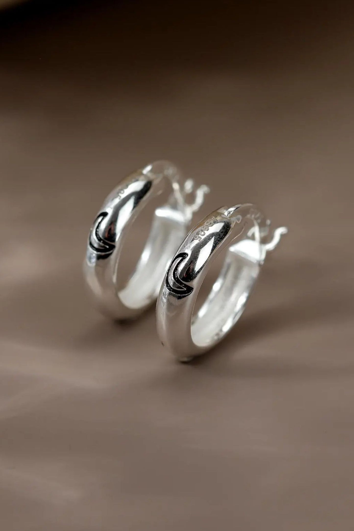 sterling-silver-engraved-moon-hoops-in-silver-closeup