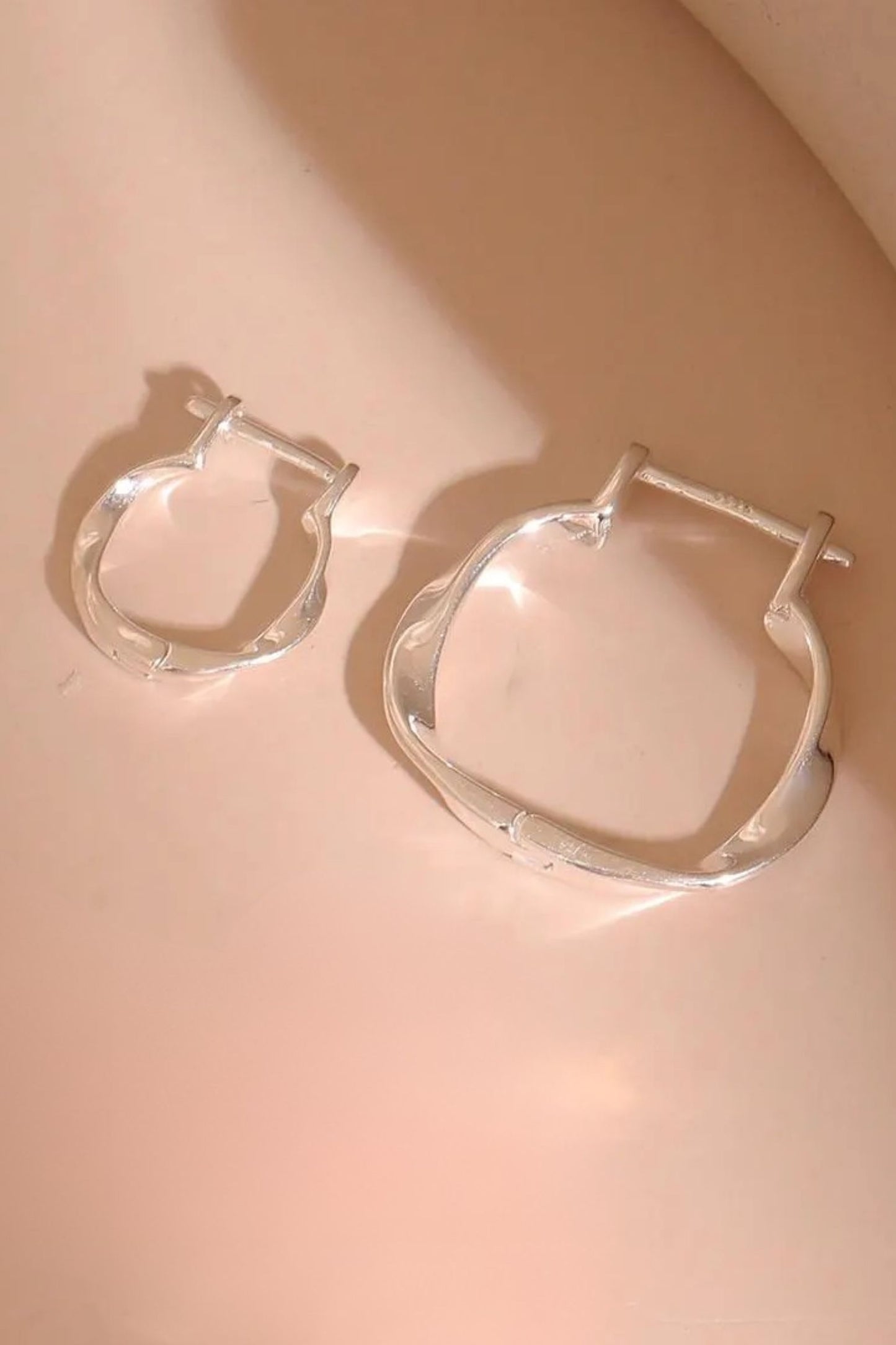 sterling-silver-twist-hoops-in-silver-both-sizes