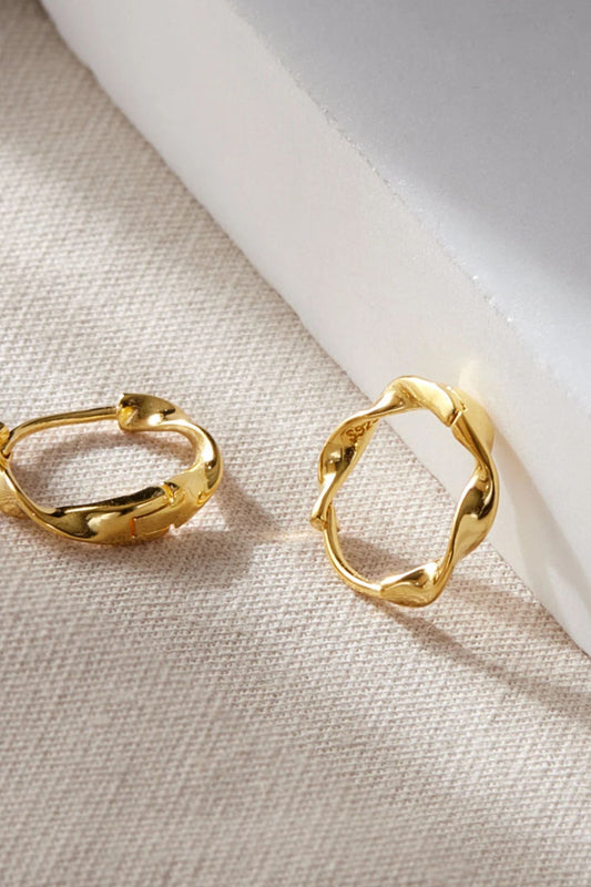 sterling-silver-minimalist-twist-hoops-in-gold-closeup