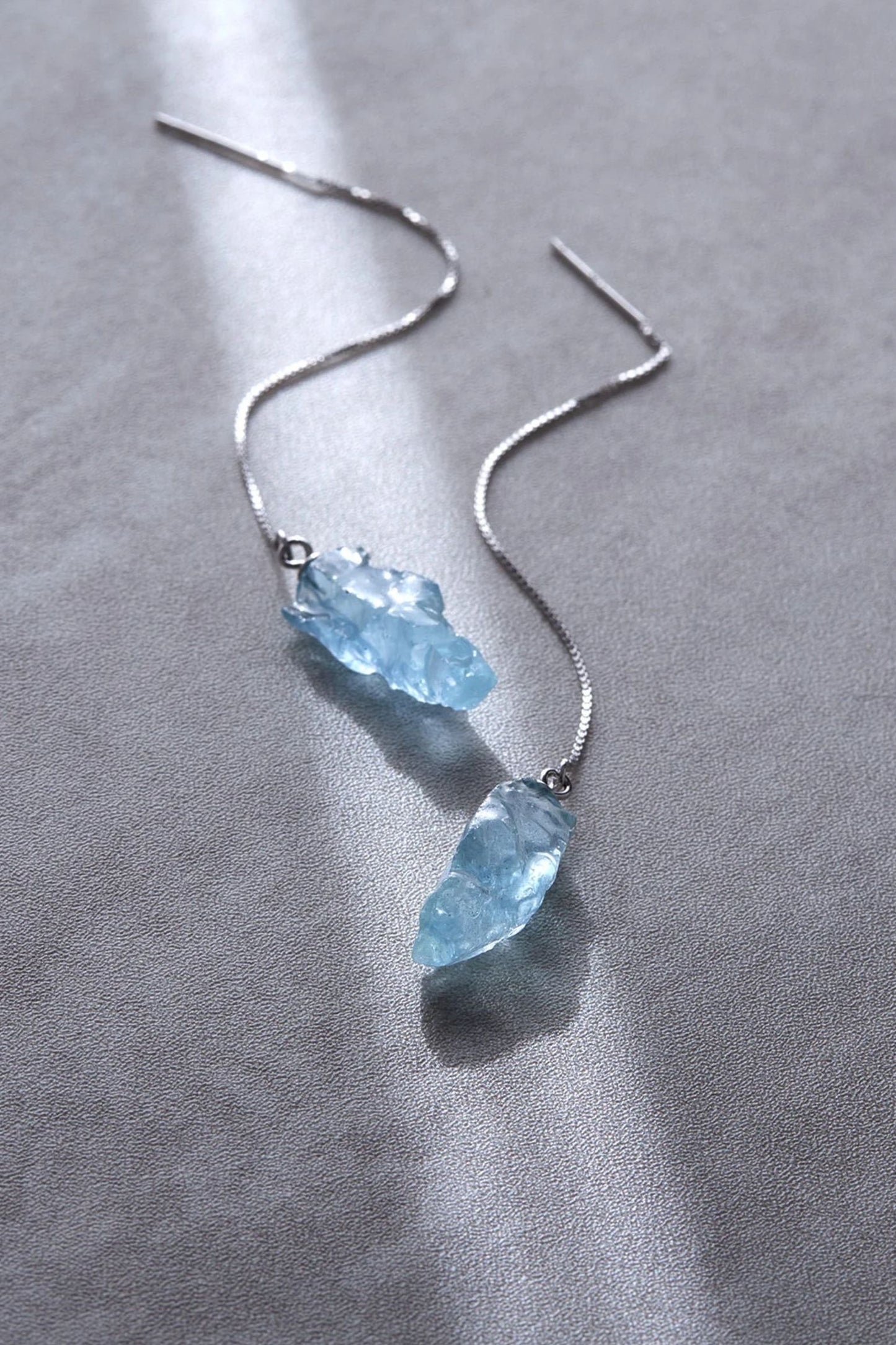 sterling-silver-blue-crystal-threader-earrings-in-silver-closeup