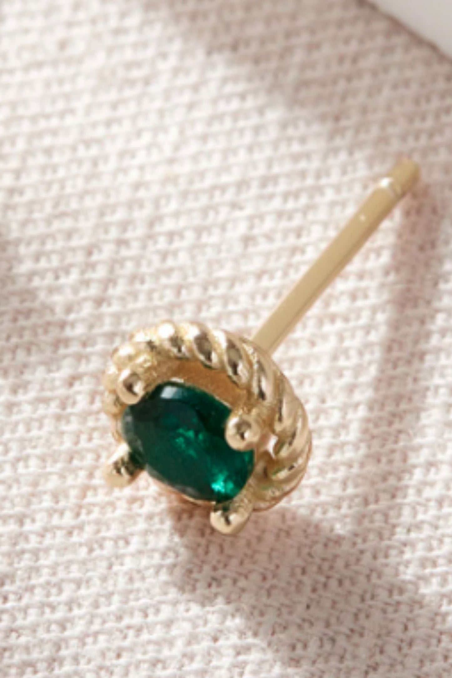 sterling-silver-round-emerald-green-studs-in-gold-closeup