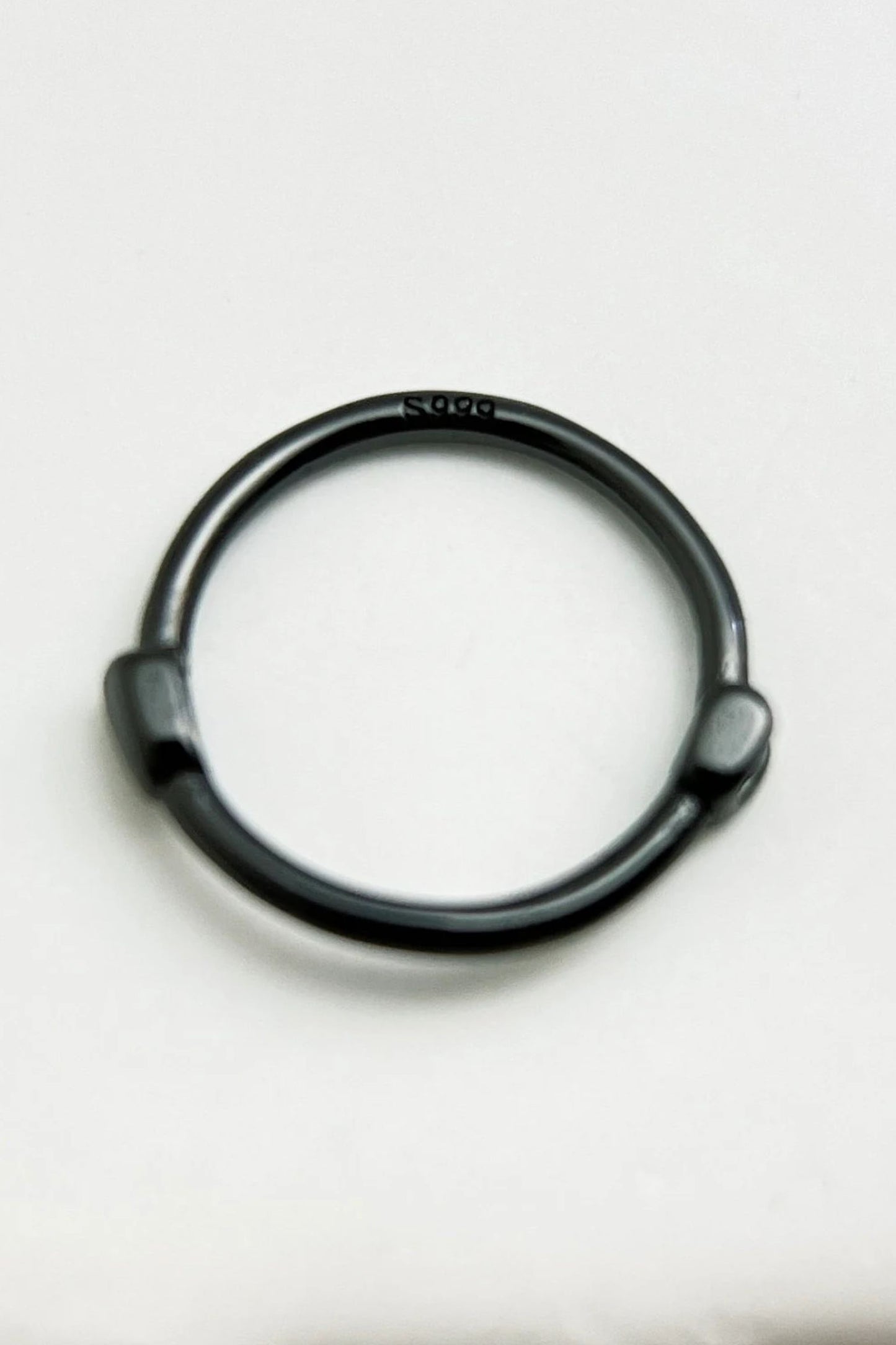 black-s999-silver-huggie-hoops-closeup-hallmark