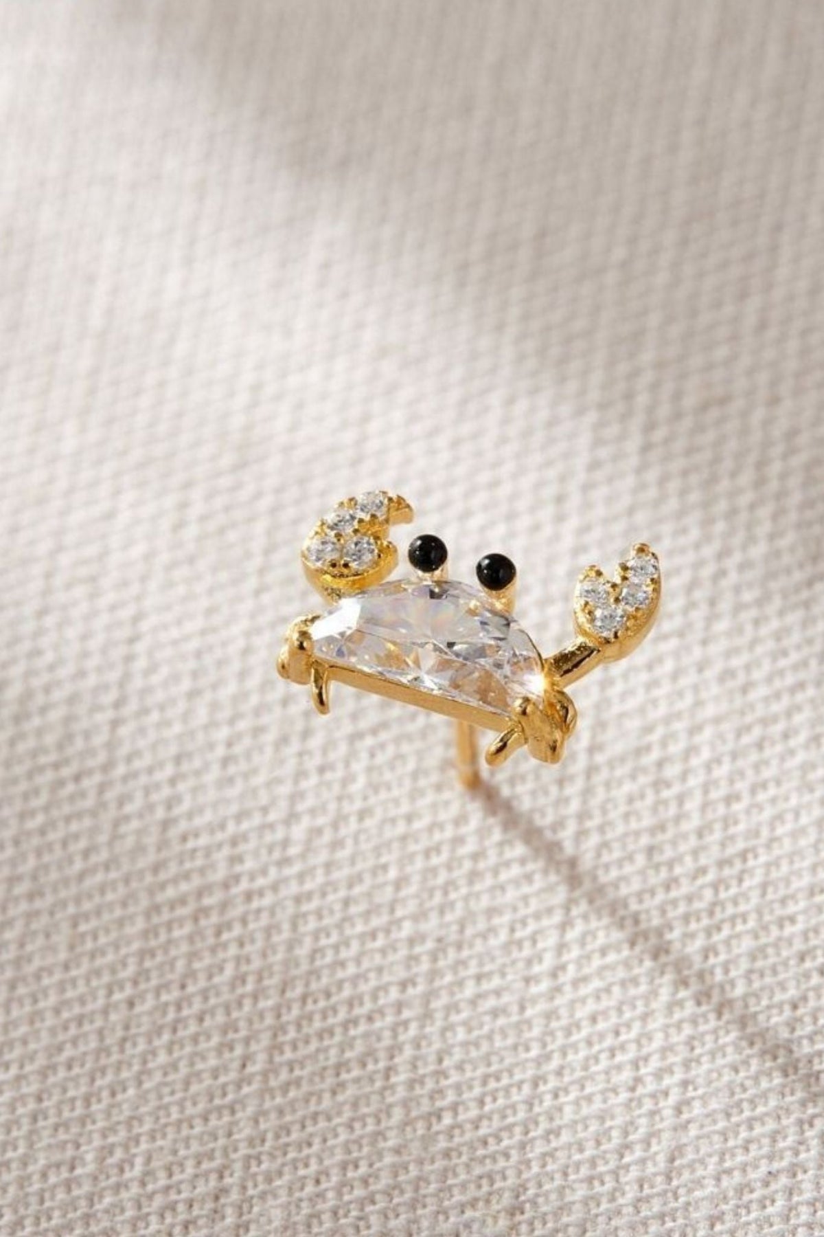 sterling-silver-cz-crab-studs-in-gold-closeup-white-crystal
