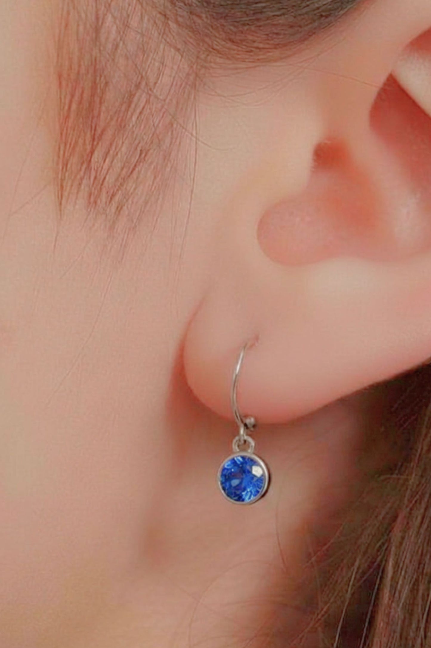 sterling-silver-cz-huggie-hoops-in-silver-light-blue-model