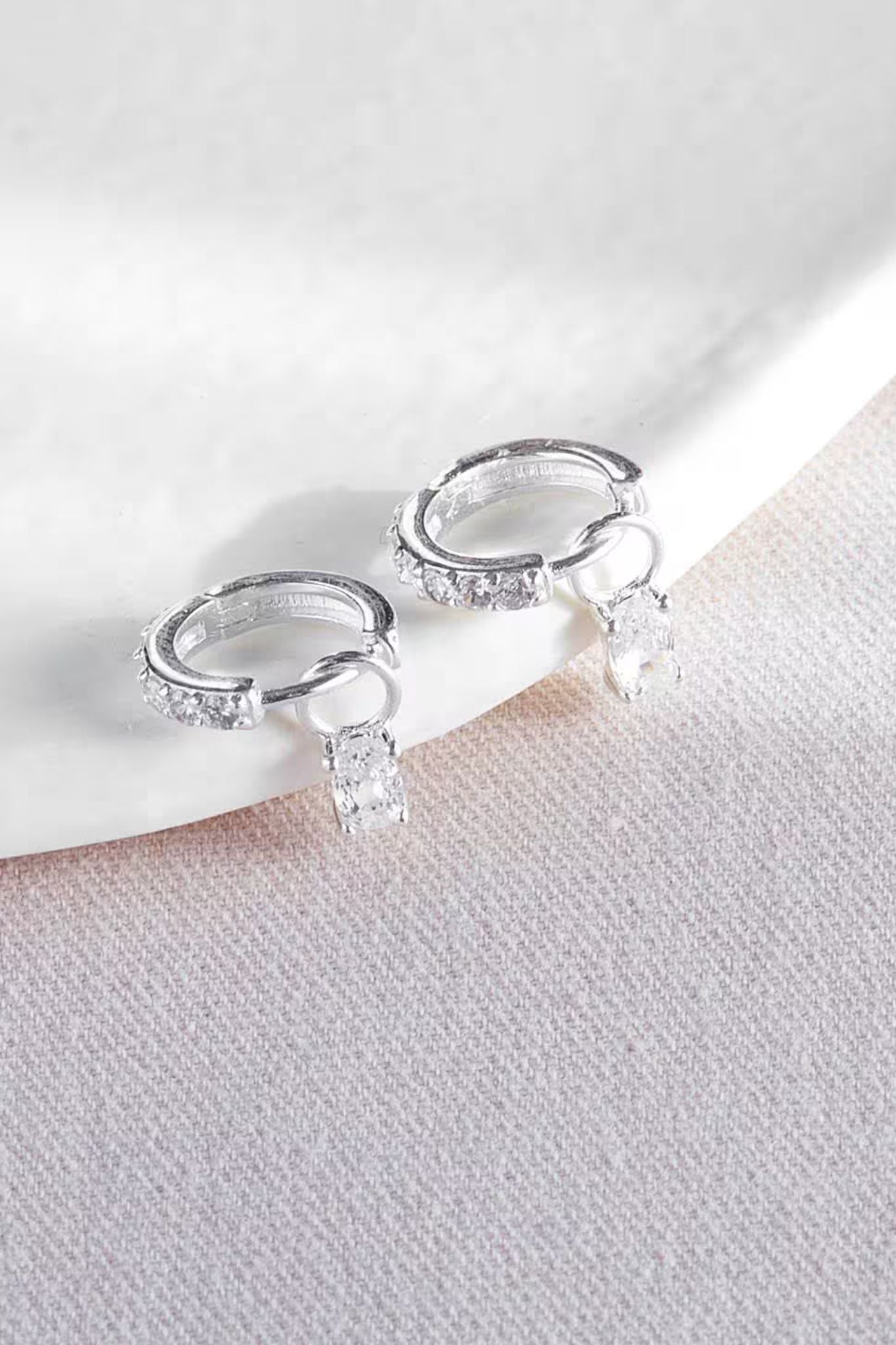 sterling-silver-cz-huggie-hoops-closeup