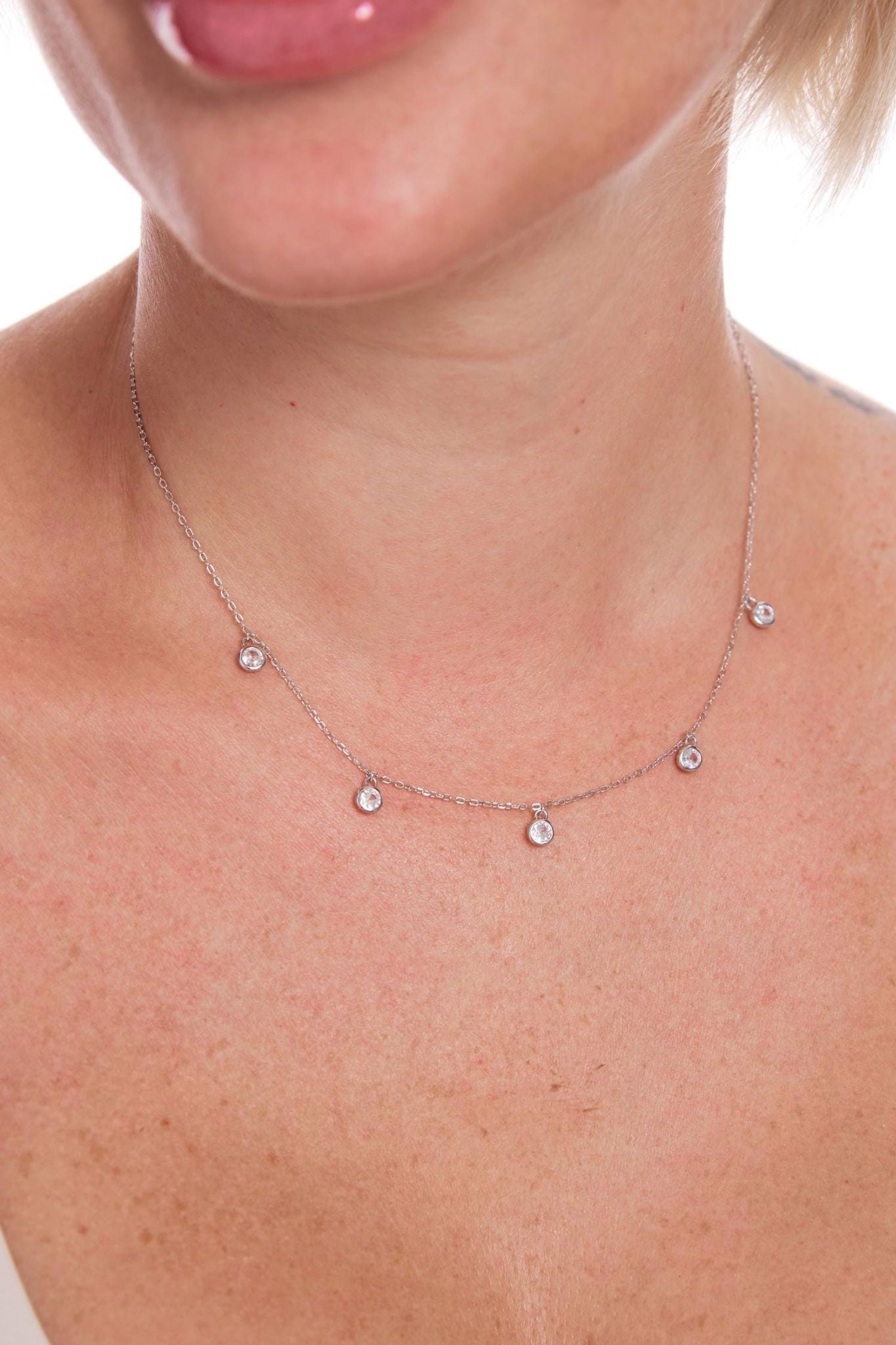 sterling-silver-cz-sparkly-charm-necklace-model-neckline