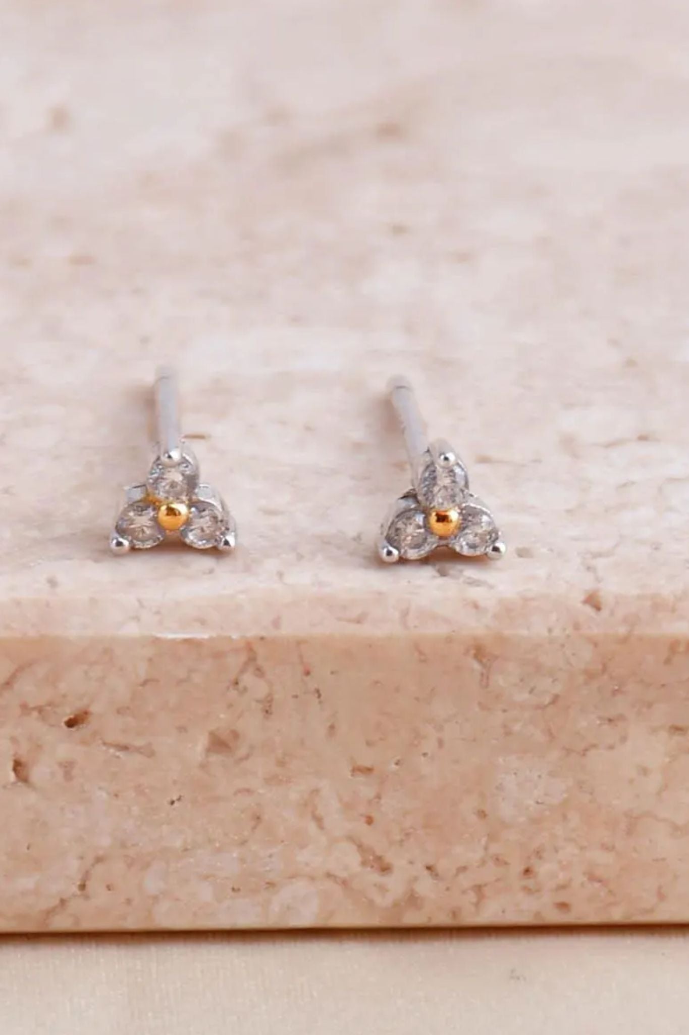 sterling-silver-cz-floral-trinity-tiny-stud-earrings-closeup