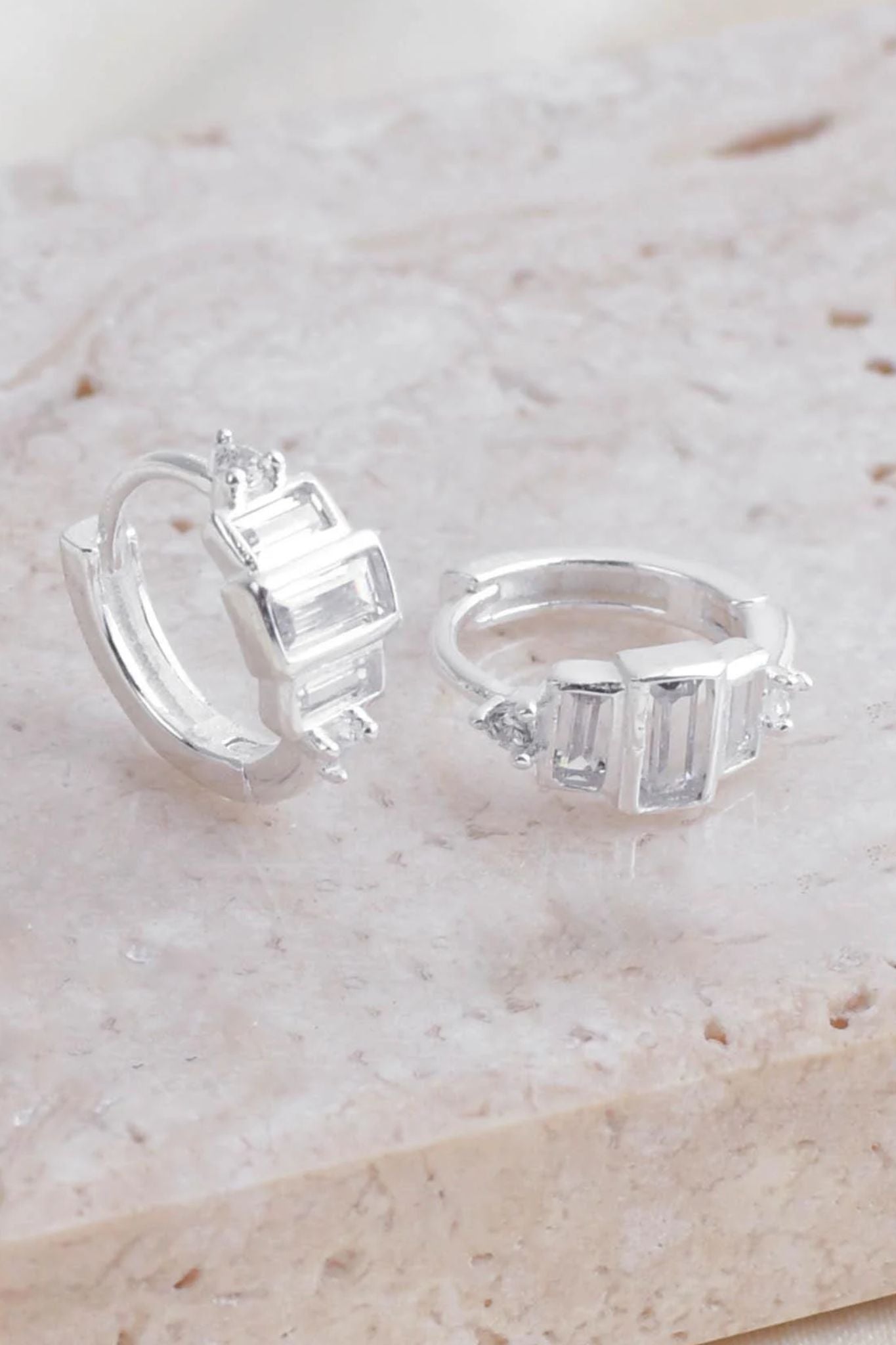 sterling-silver-cz-croissant-huggie-hoops-closeup
