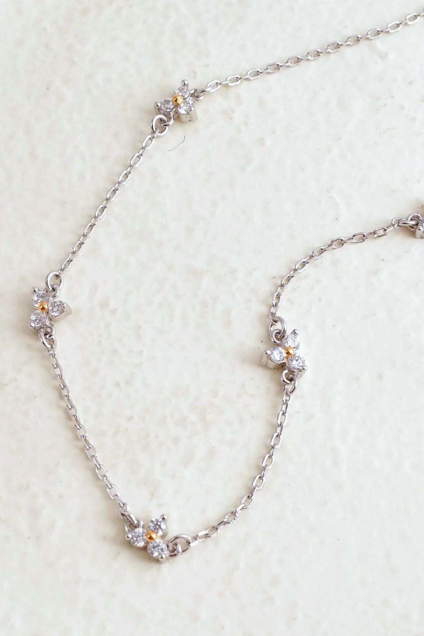 sterling-silver-dainty-cz-flower-necklace-closeup