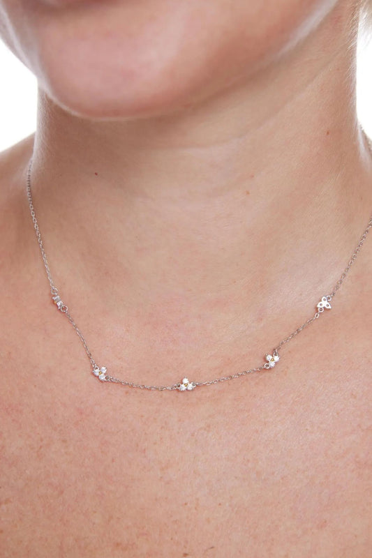 sterling-silver-dainty-cz-flower-necklace-model-neckline