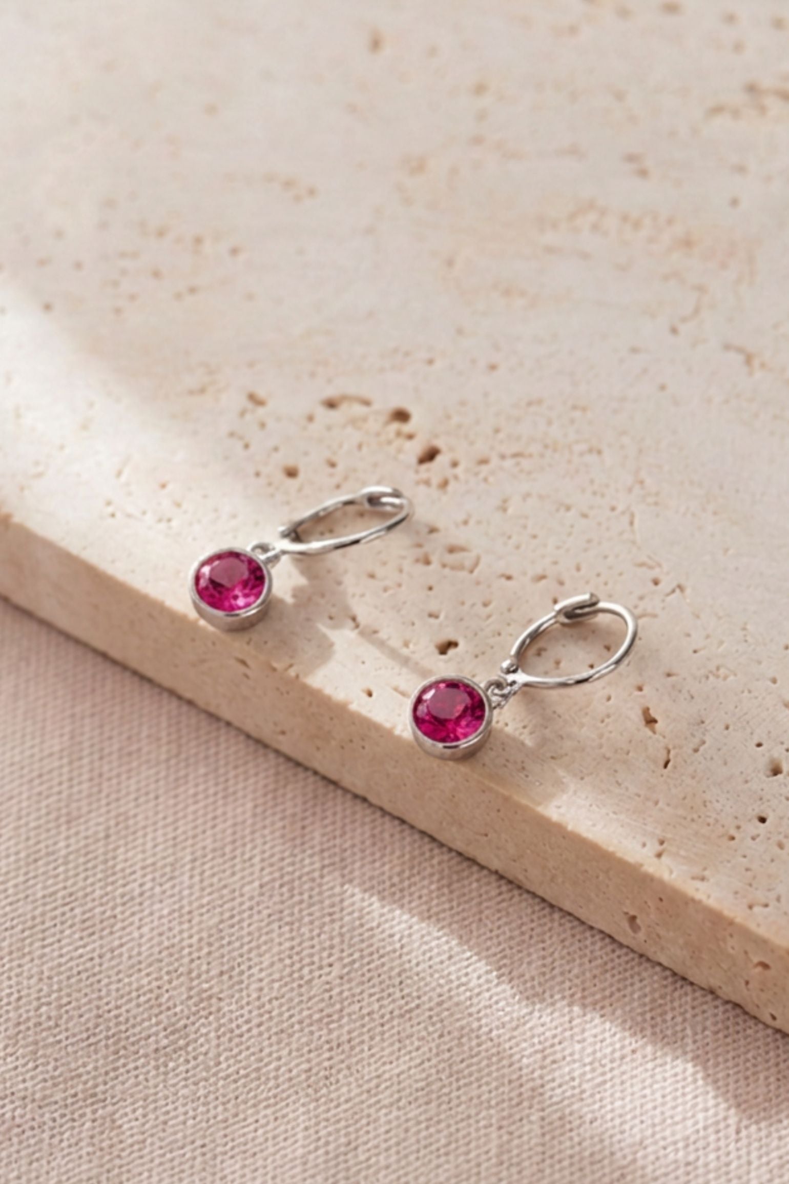 sterling-silver-cz-huggie-hoops-in-silver-fuchsia