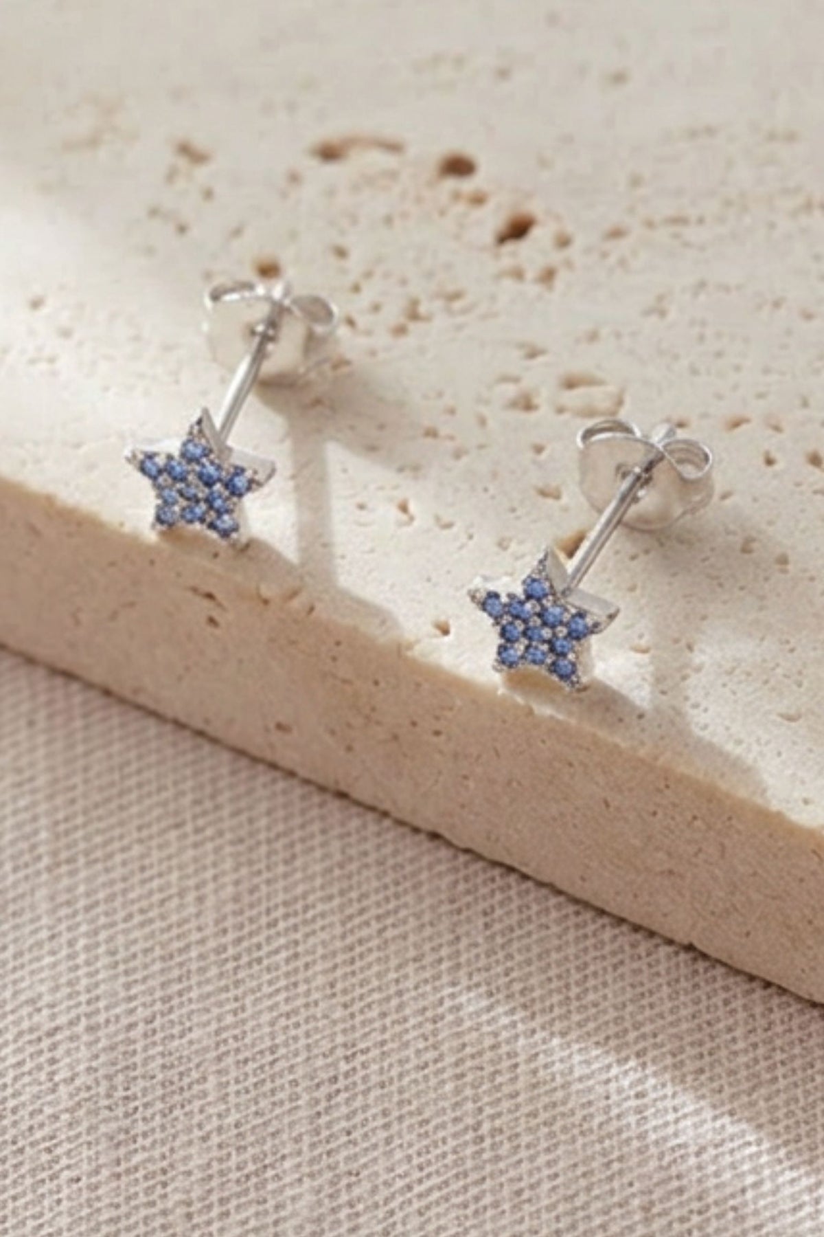 sterling-silver-sparkly-star-studs-in-silver-light-blue