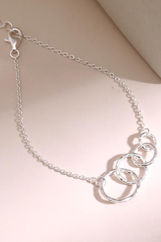 sterling-silver-four-circles-bracelet-lying-flat