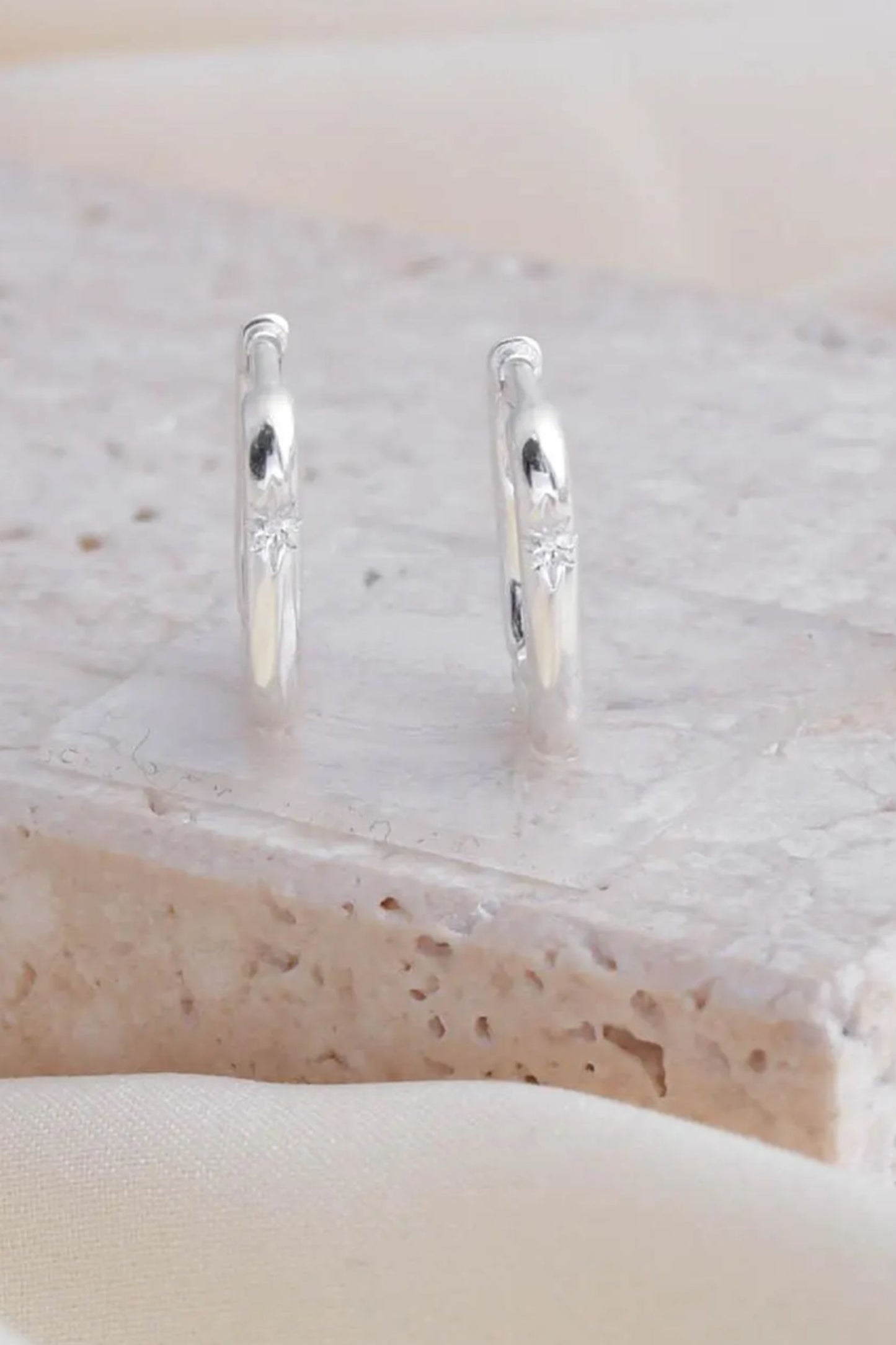 sterling-silver-starburst-engraved-rectangular-hoops-various-sizes-closeup