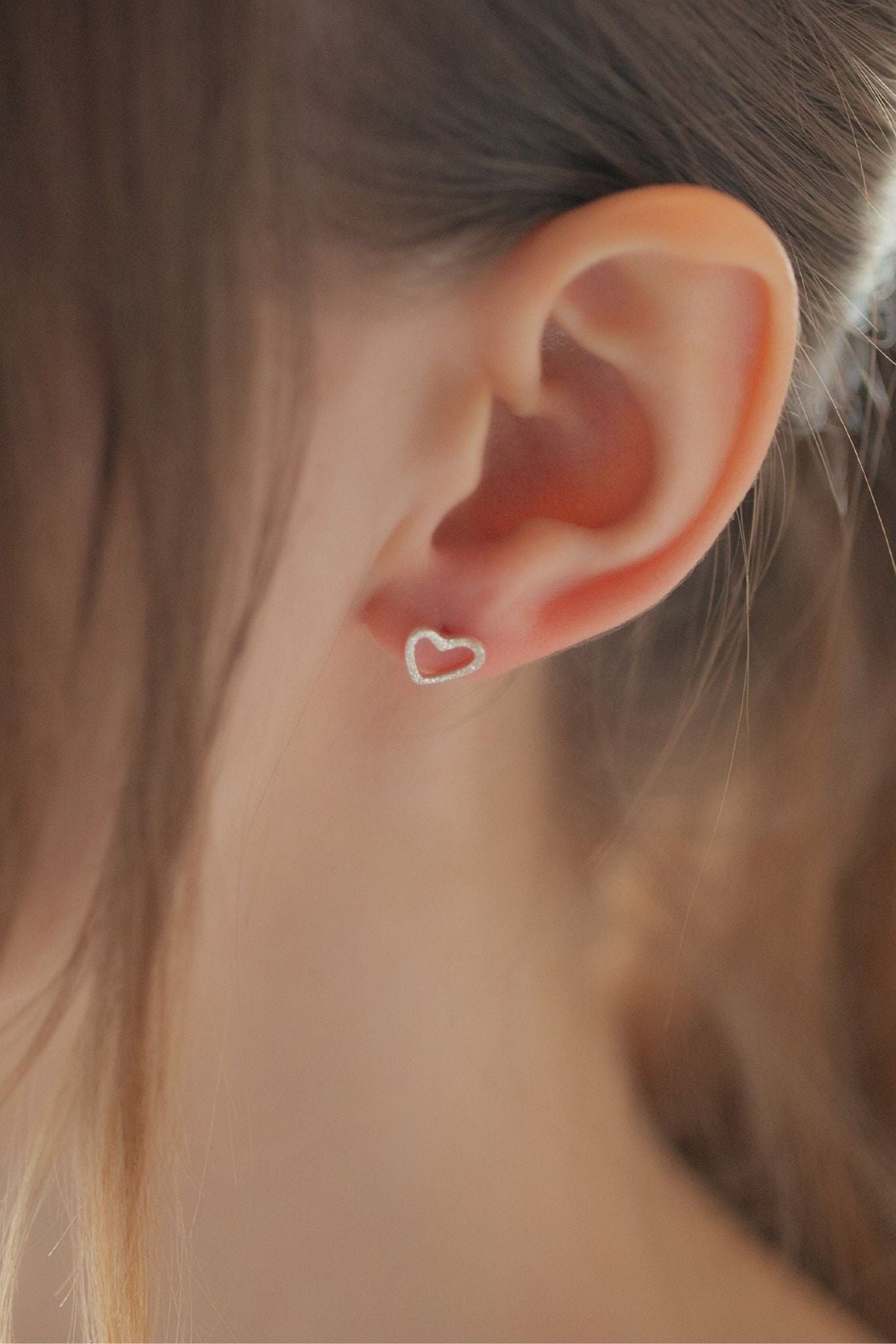 sterling-silver-frosted-open-heart-stud-earrings-model
