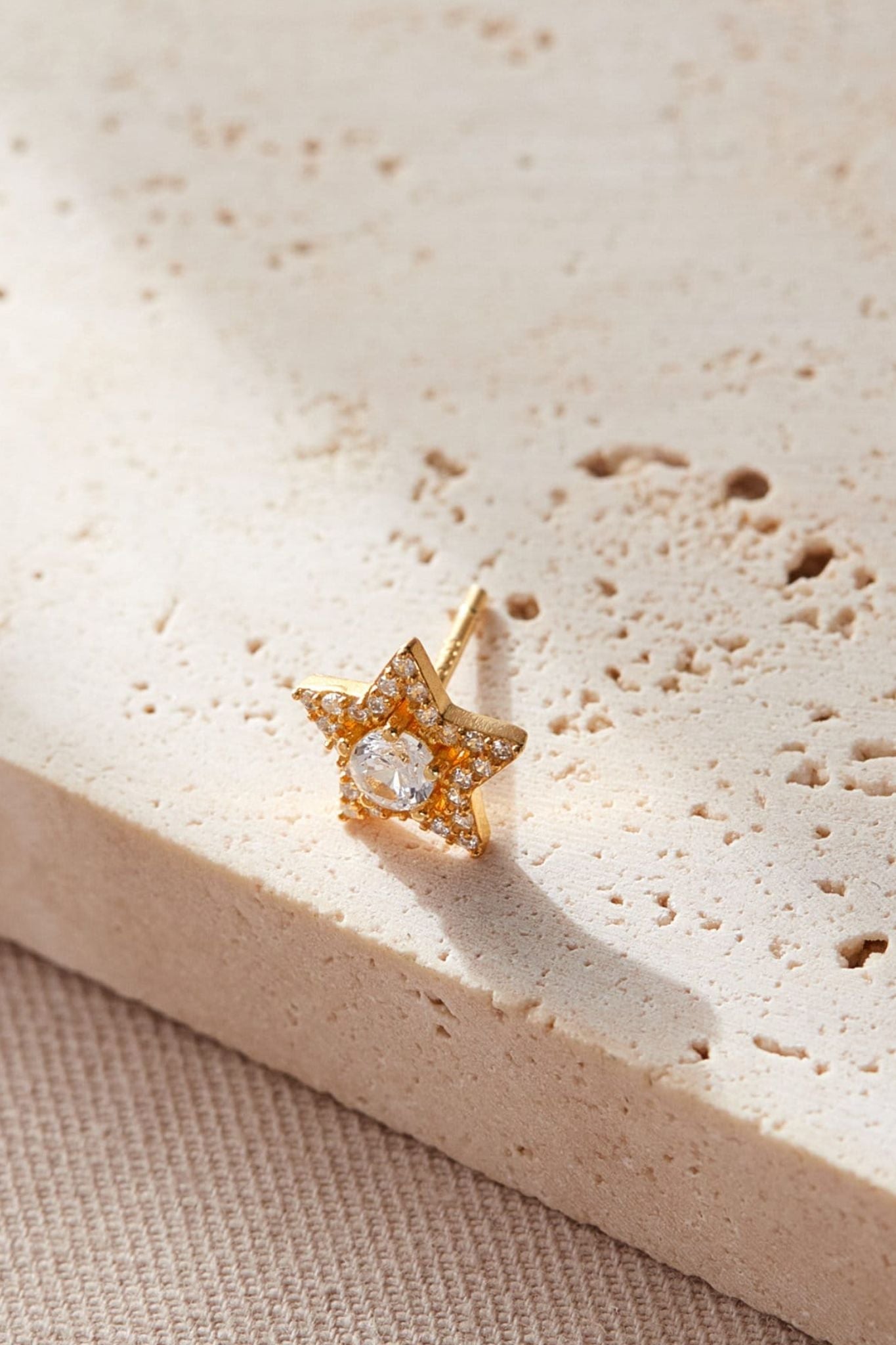 sterling-silver-cz-star-studs-in-gold-closeup