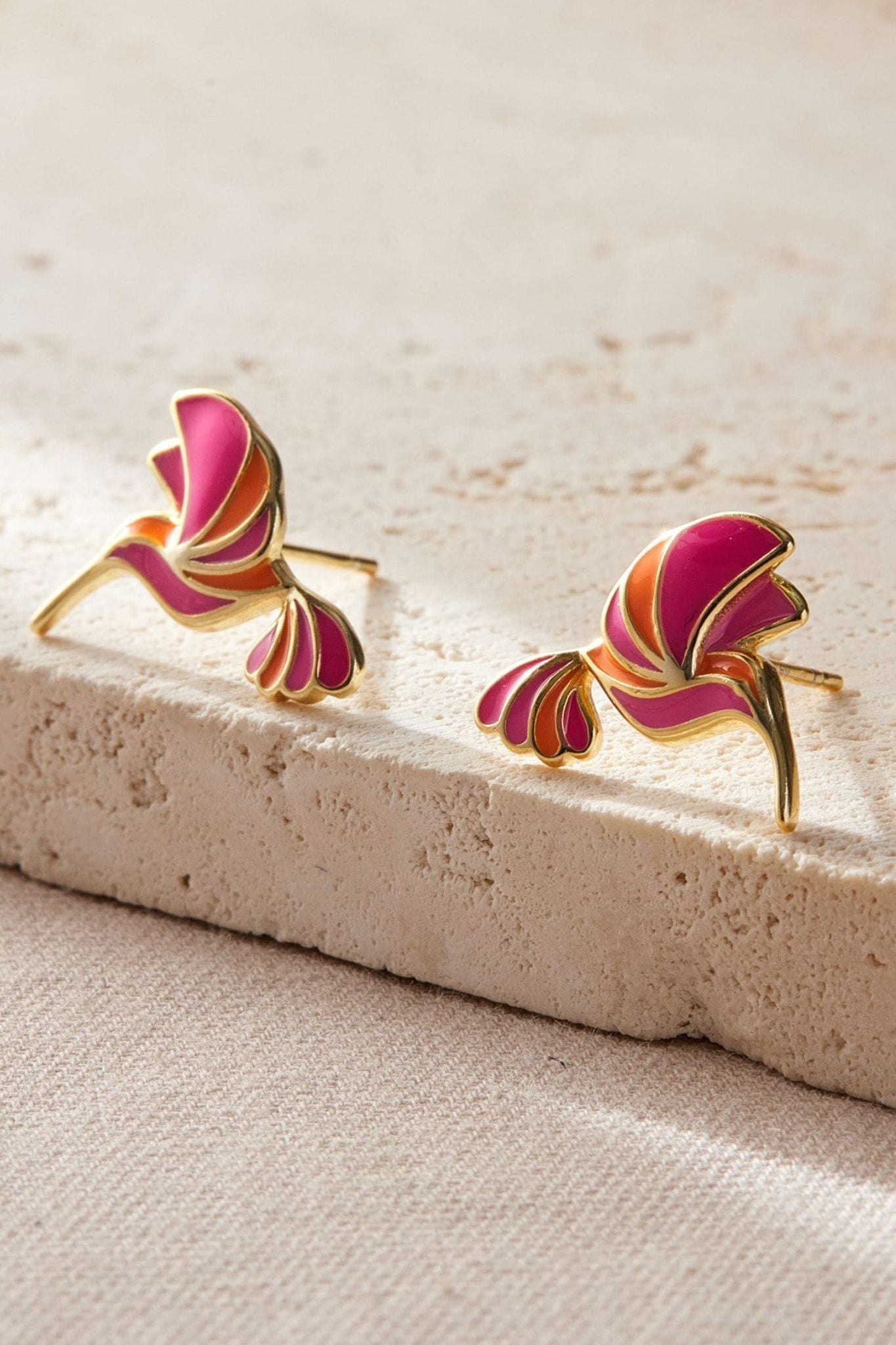 sterling-silver-pink-hummingbird-studs-in-gold-closeup