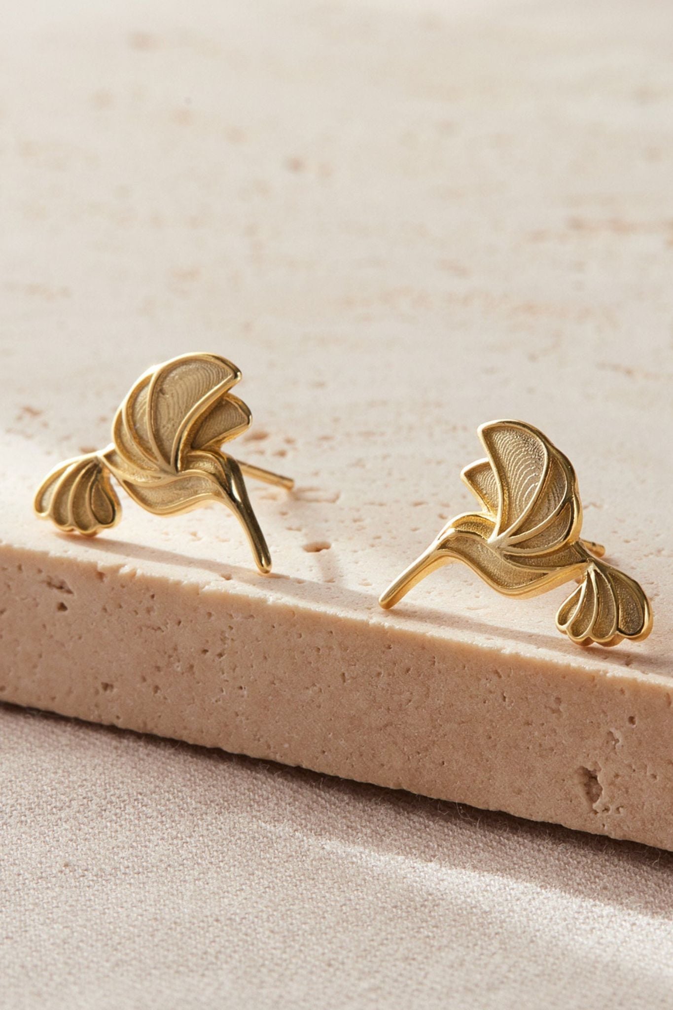 sterling-silver-hummingbird-studs-in-gold-closeup