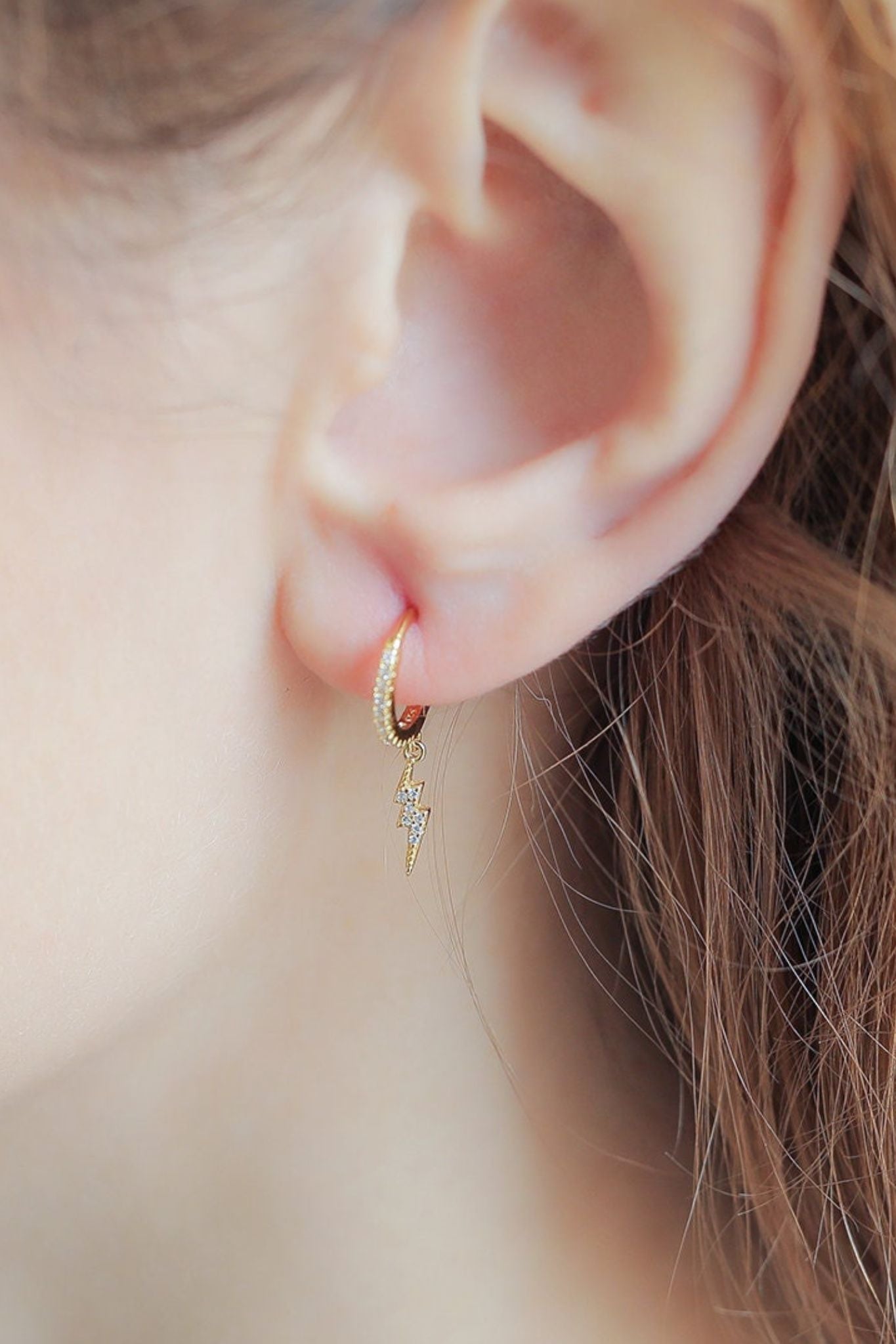 sterling-silver-cz-lightning-bolt-hoops-in-gold-model