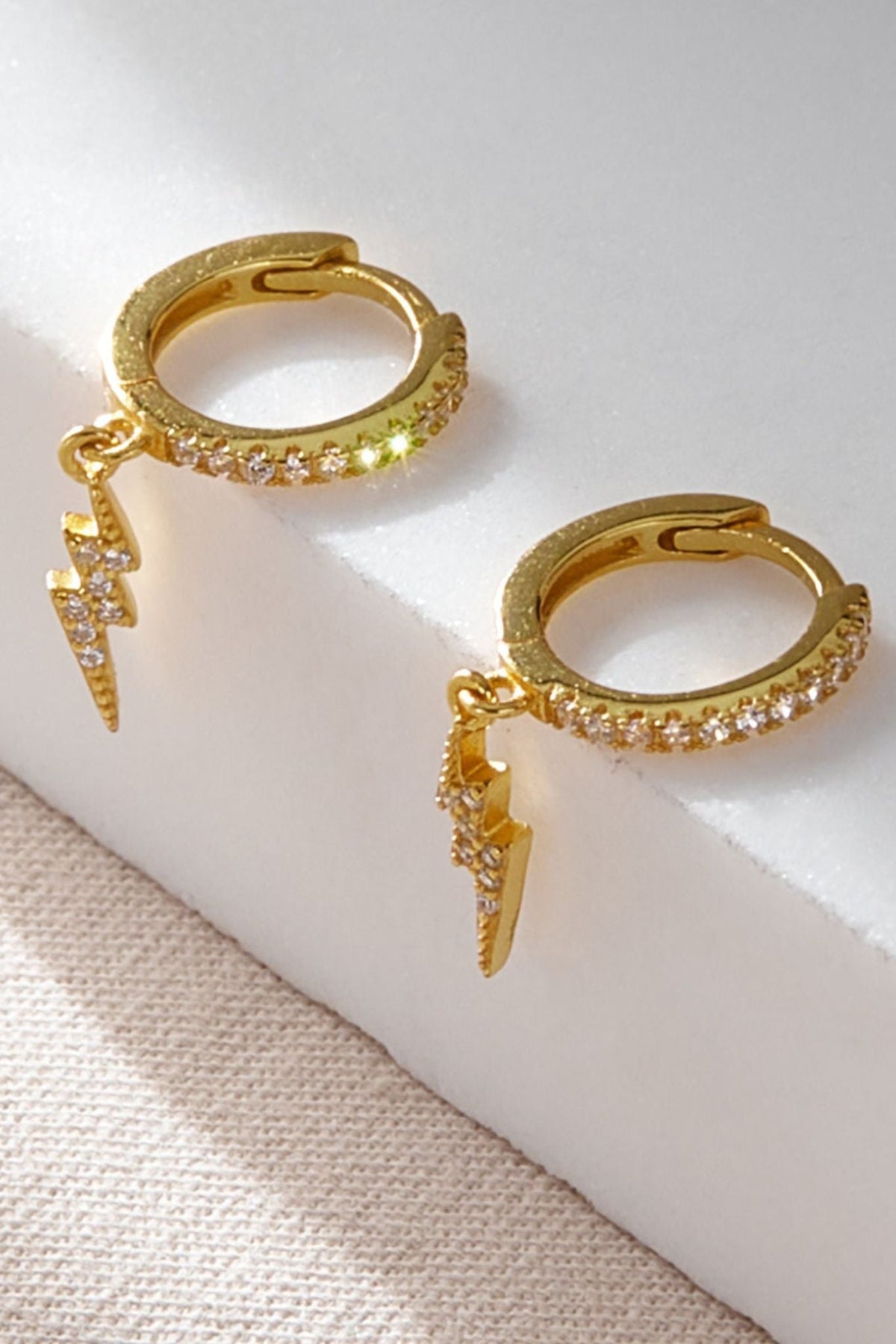 sterling-silver-cz-lightning-bolt-hoops-in-gold
