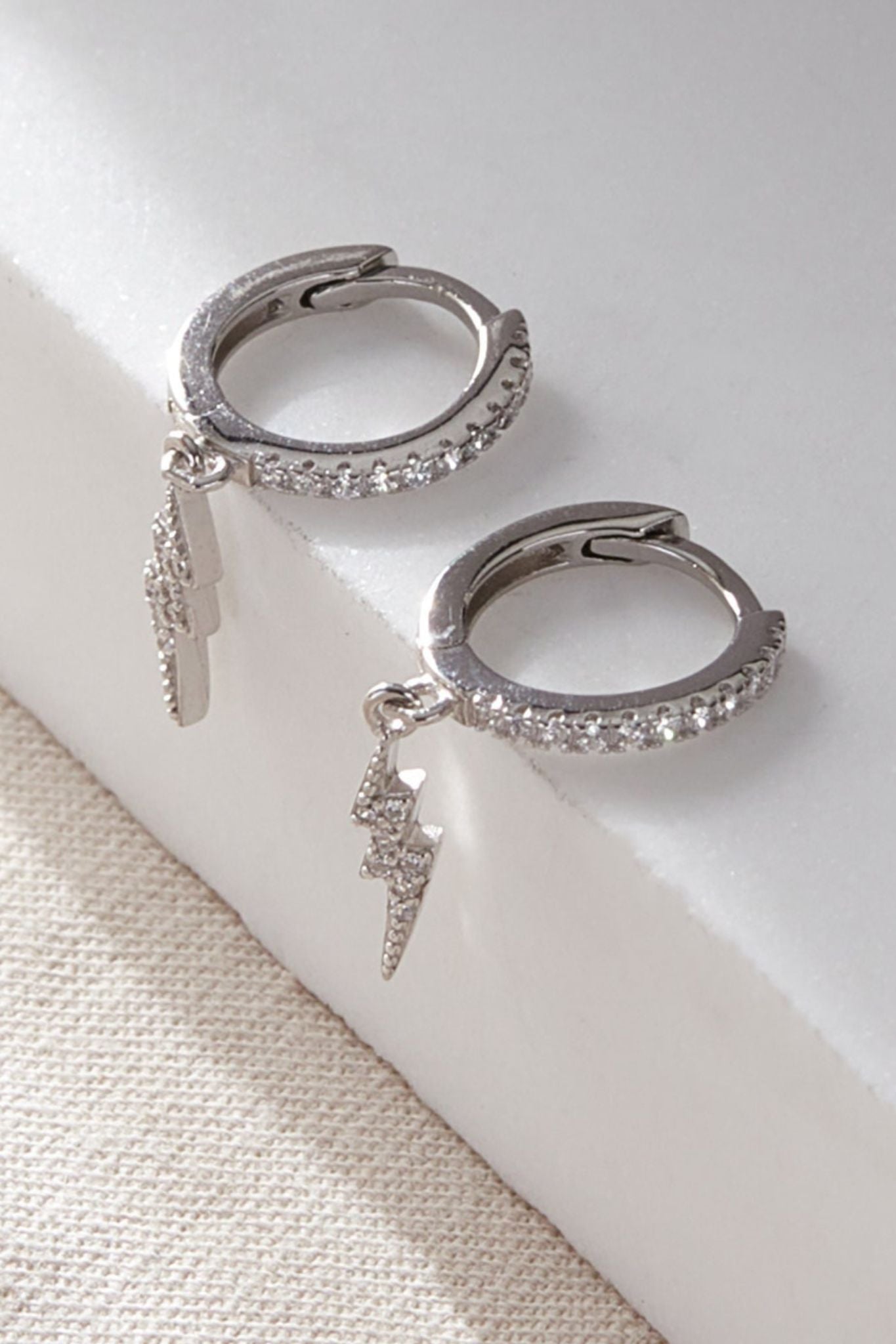 sterling-silver-cz-lightning-bolt-hoops-in-silver