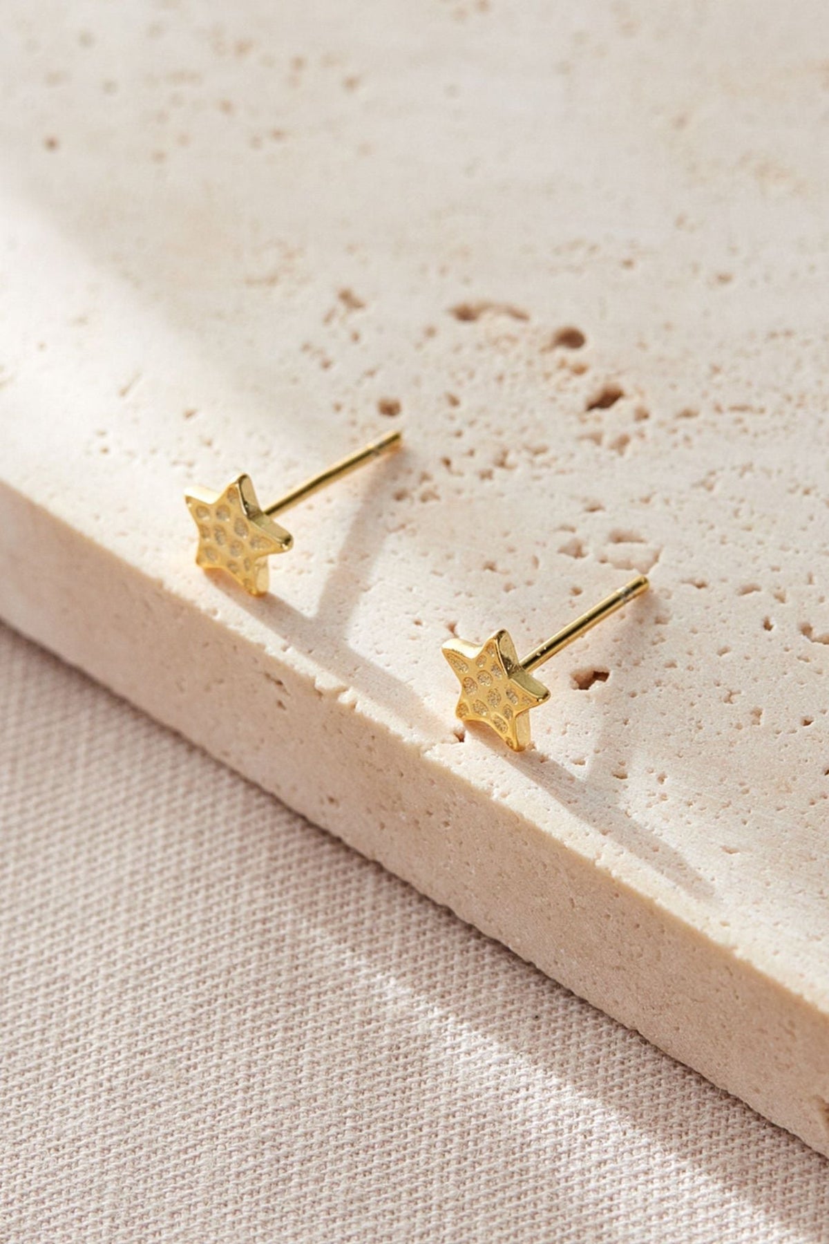 sterling-silver-hammered-star-studs-6mm-in-gold