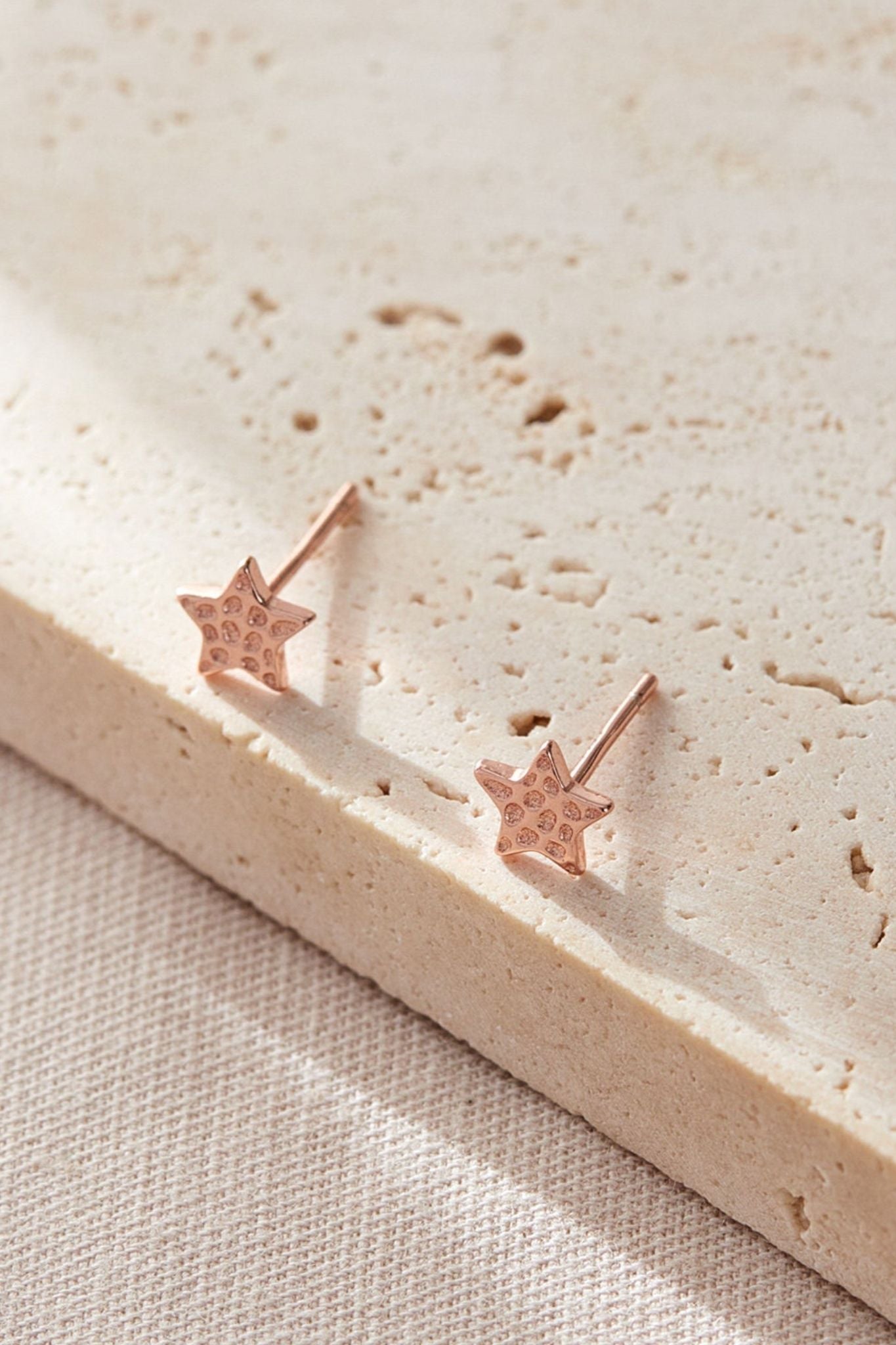 sterling-silver-hammered-star-studs-6mm-in-rose-gold